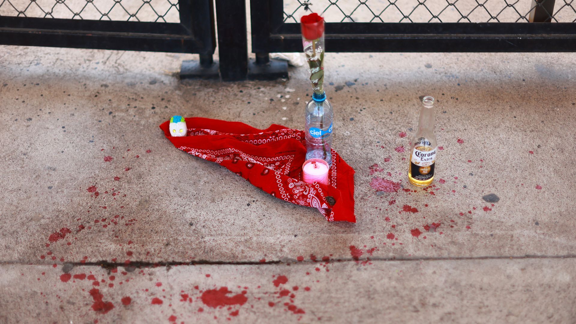 A flower and beer left as an altar near one of the entrances to Estadio Corregidora.