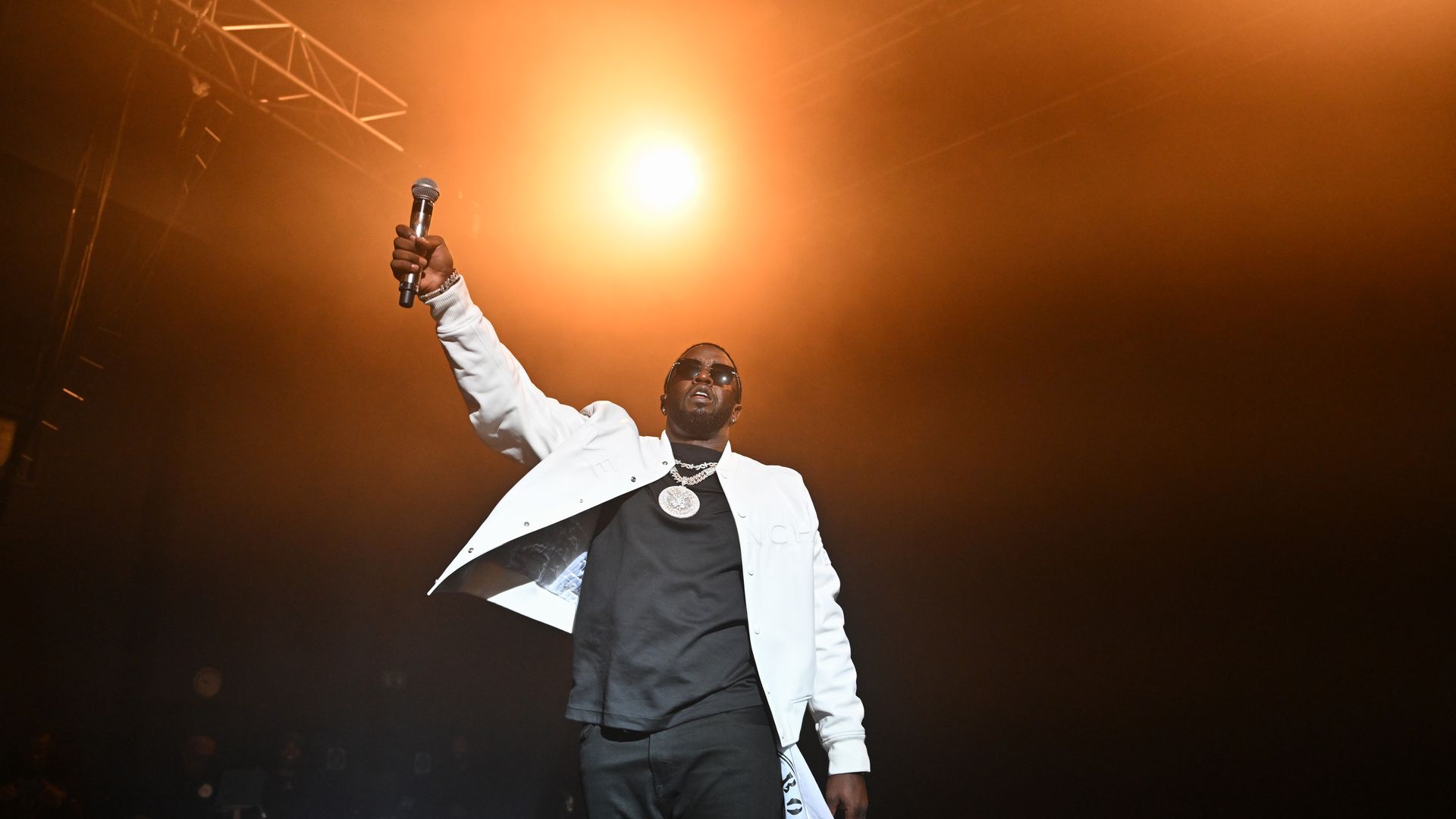 Sean "Diddy" Combs performs on a stage.