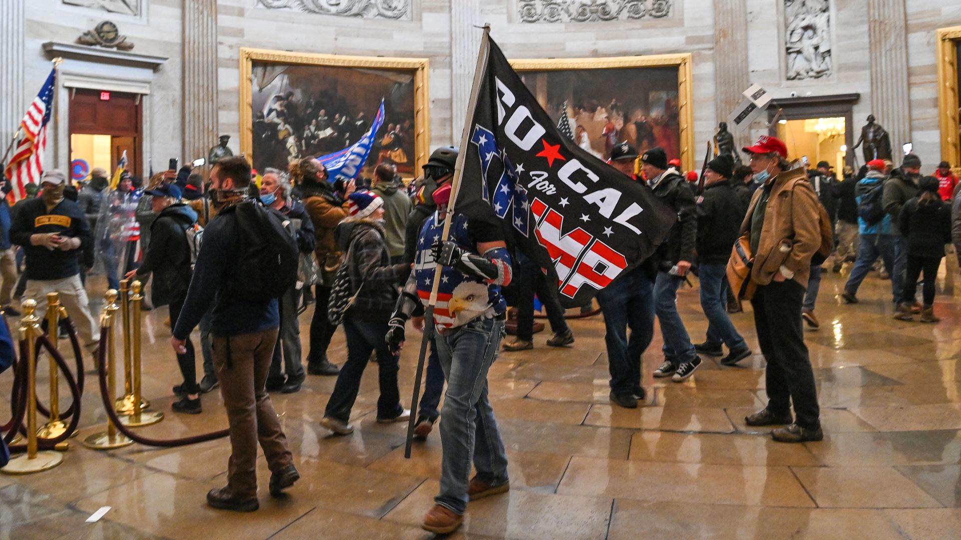 Supporters of US President Donald Trump roam under the Capitol Rotunda after invading the Capitol building on January 6, 2021, in Washington, DC.