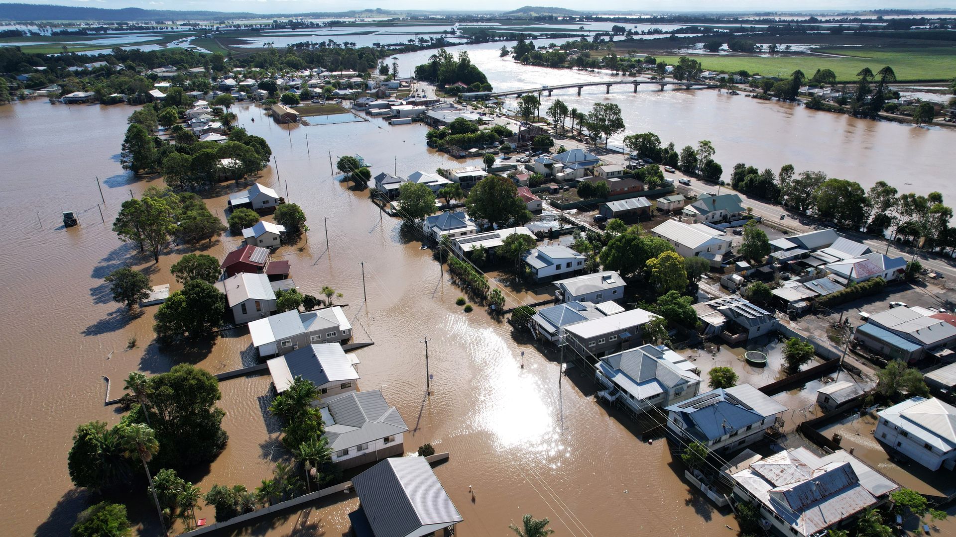  An aerial drone view of houses inundated by floodwater on March 07, 2022 in Woodburn, Australia. 