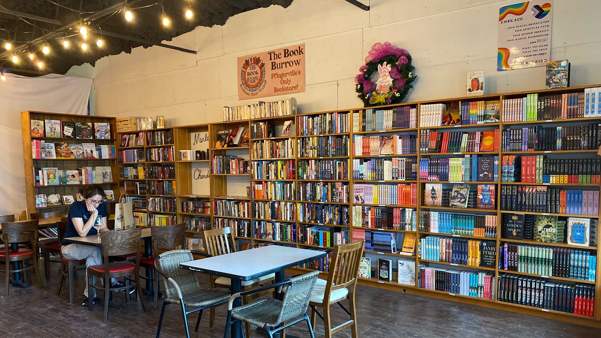 The scene inside a new Pflugerville book store — lots of books on shelves!