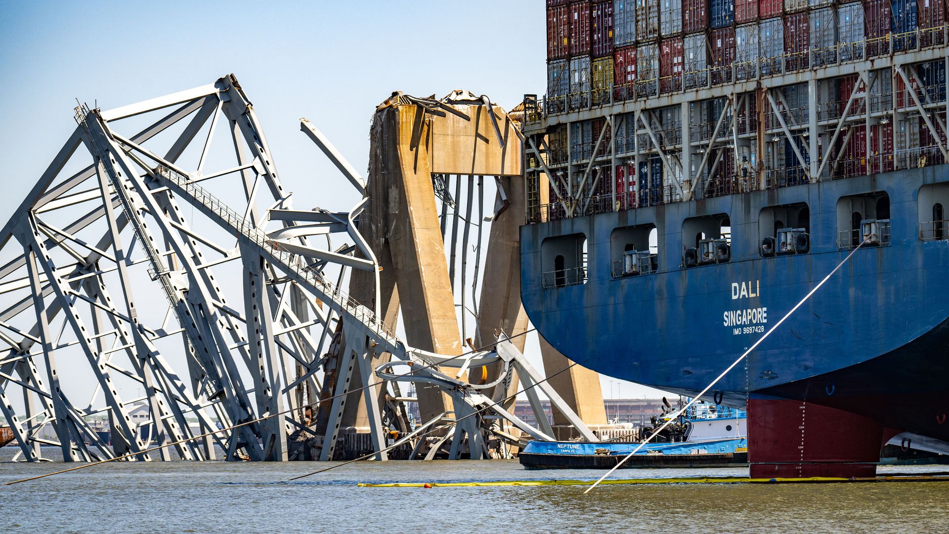 The wreckage of the Francis Scott Key Bridge is seen beyond the stern of the container ship Dali three weeks after the catastrophic collapse. (Jerry Jackson/The Baltimore Sun/Tribune News Service via Getty Images)