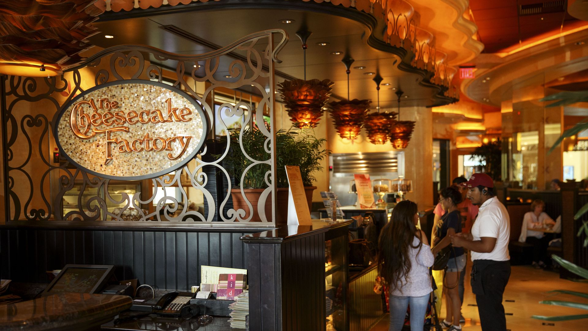 Diners wait at a Cheesecake Factory restaurant in Los Angeles's Canoga Park neighborhood, California. Photographer: Patrick T. Fallon/Bloomberg via Getty Images


