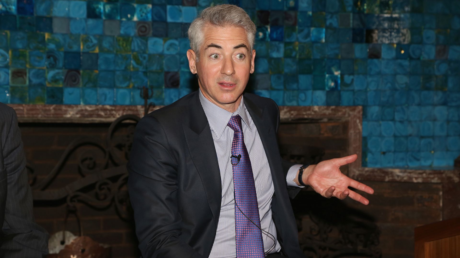 Bill Ackman sits in a char.