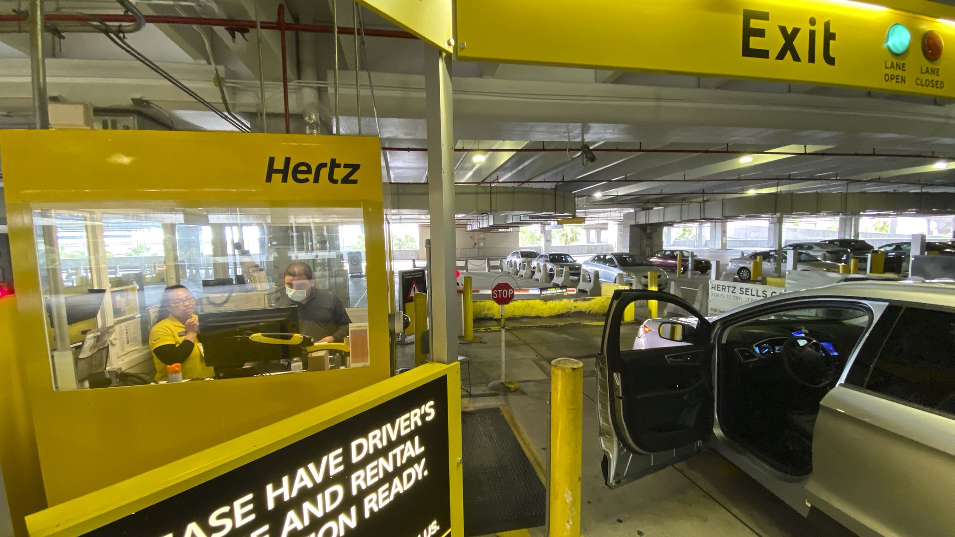 In this image, a car is in a parking garage