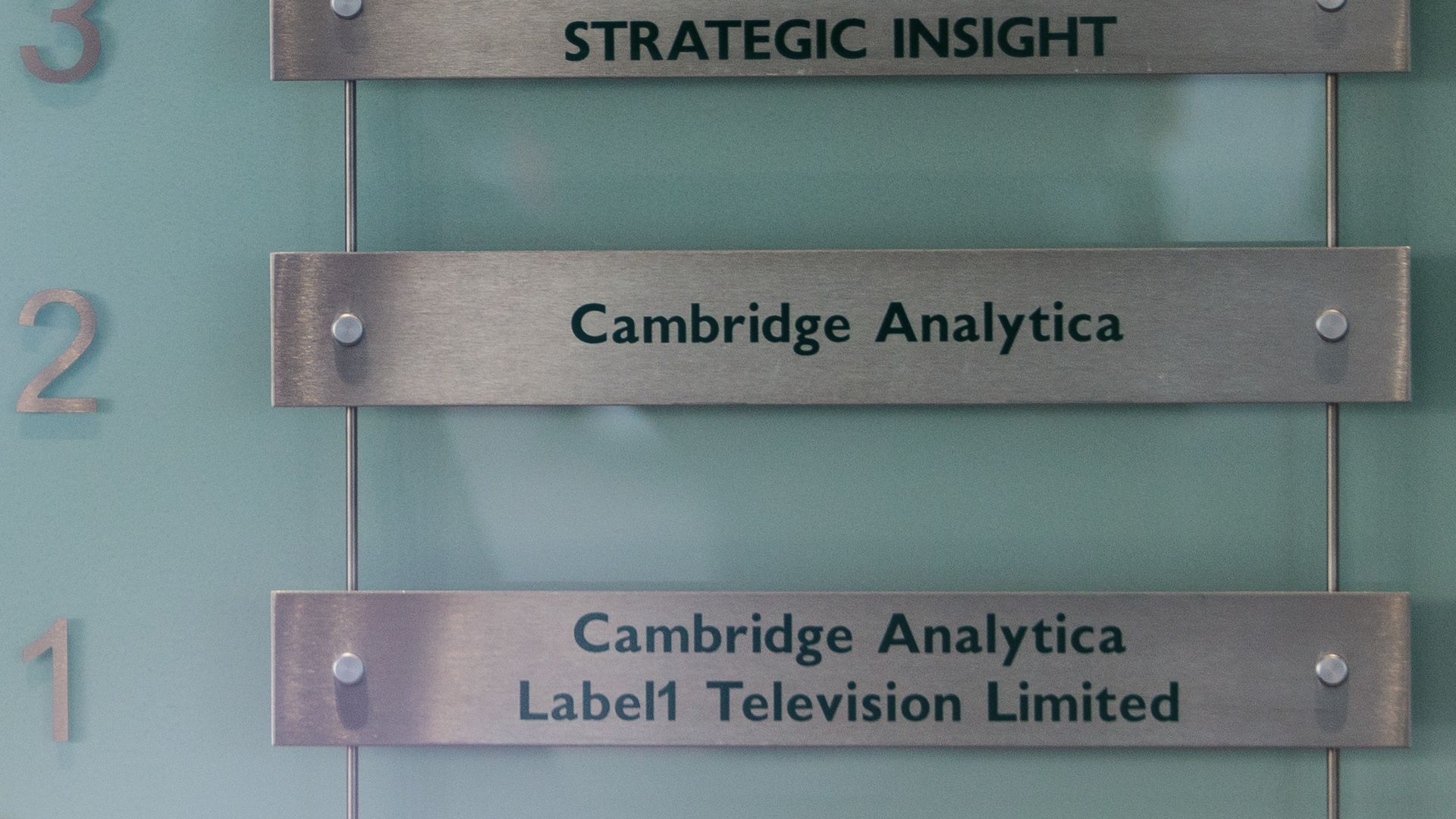 A sign reading "Cambridge Analytica"