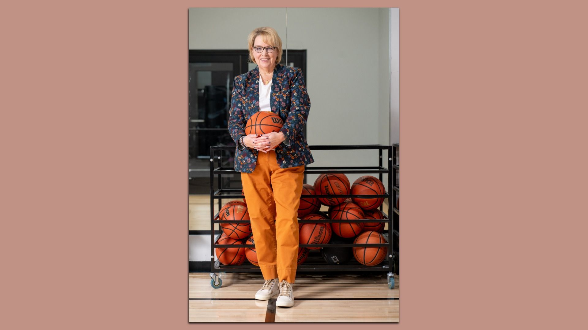 Nancy VanReece smiles with a basketball.