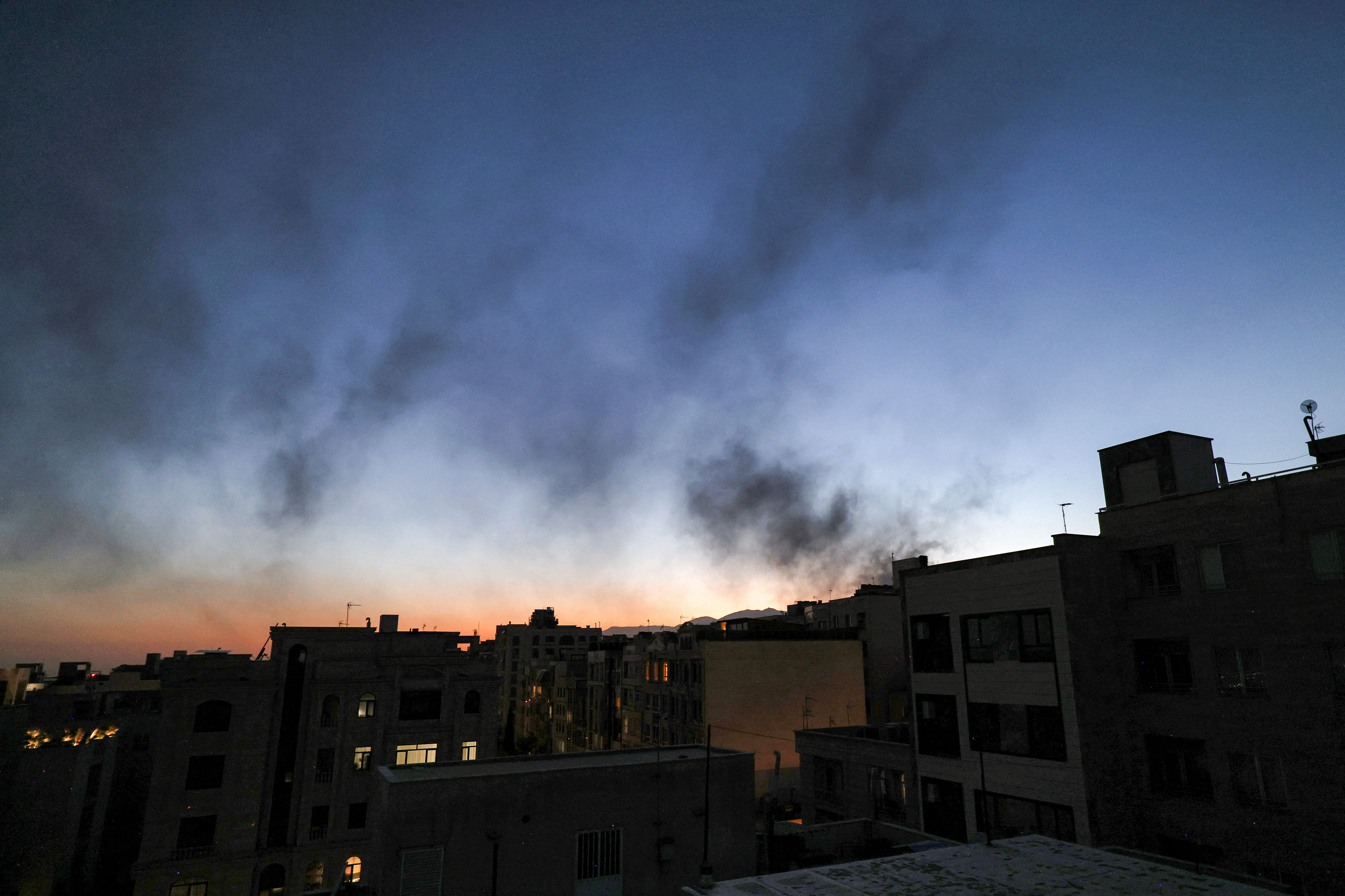 Smoke plumes billow following an overnight Israeli strike on Tehran on June 17, 2025. (Photo by ATTA KENARE / AFP) (Photo by ATTA KENARE/AFP via Getty Images)