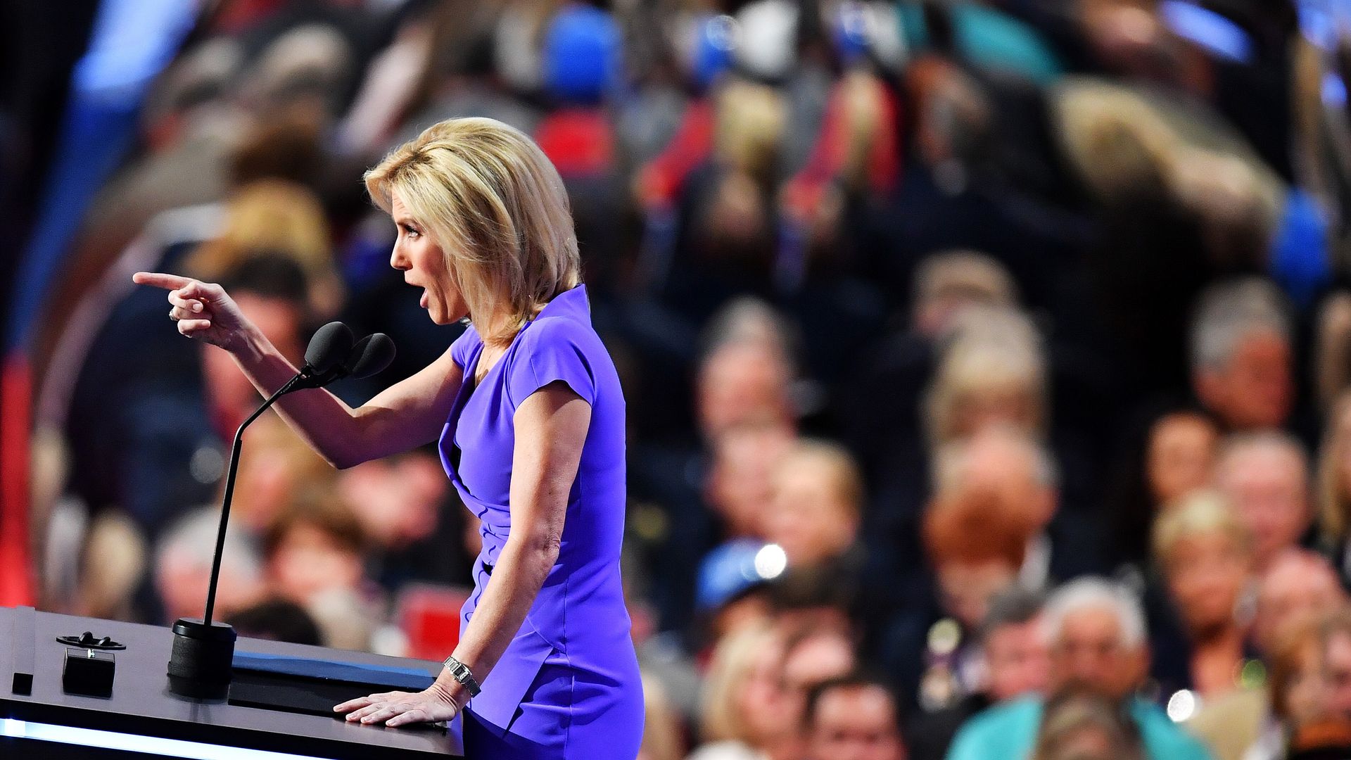 Laura Ingraham speaking at a podium. 