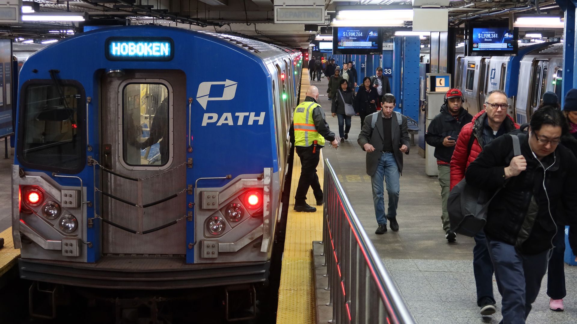 A PATH train arrives at the 33rd Street Station from Hoboken, New Jersey during rush hour on March 12