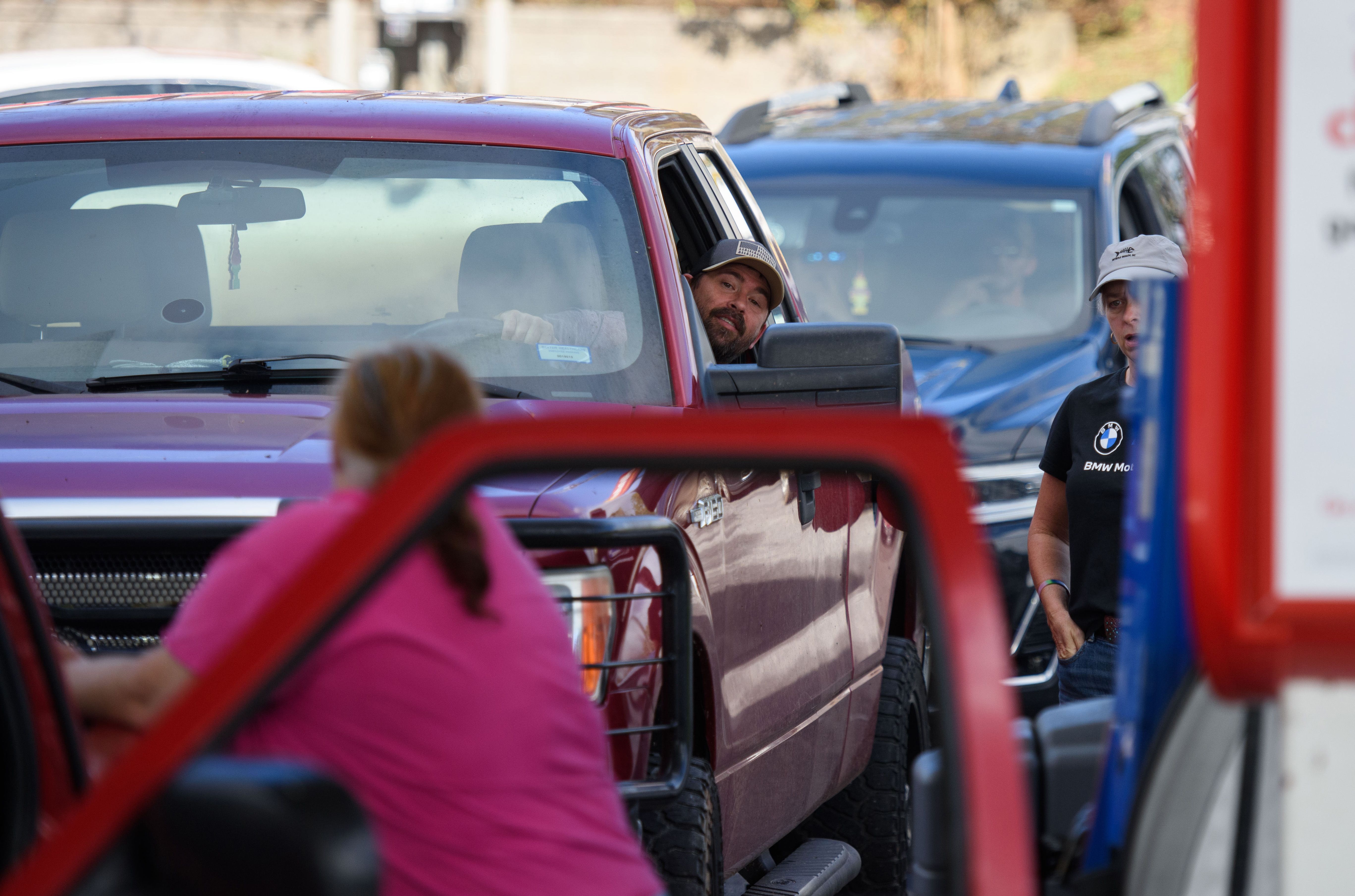 people lined up at a gas station in western NC after Tropical Storm Helene