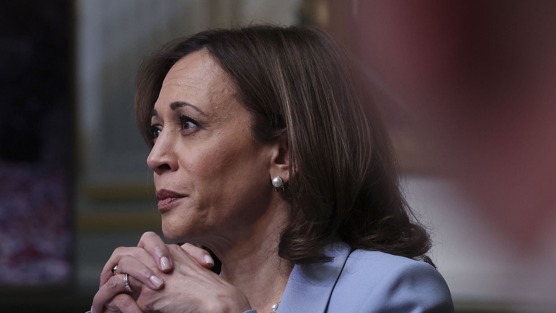 A close shot of Vice President Kamala Harris resting her head on her hands, which are interwoven.