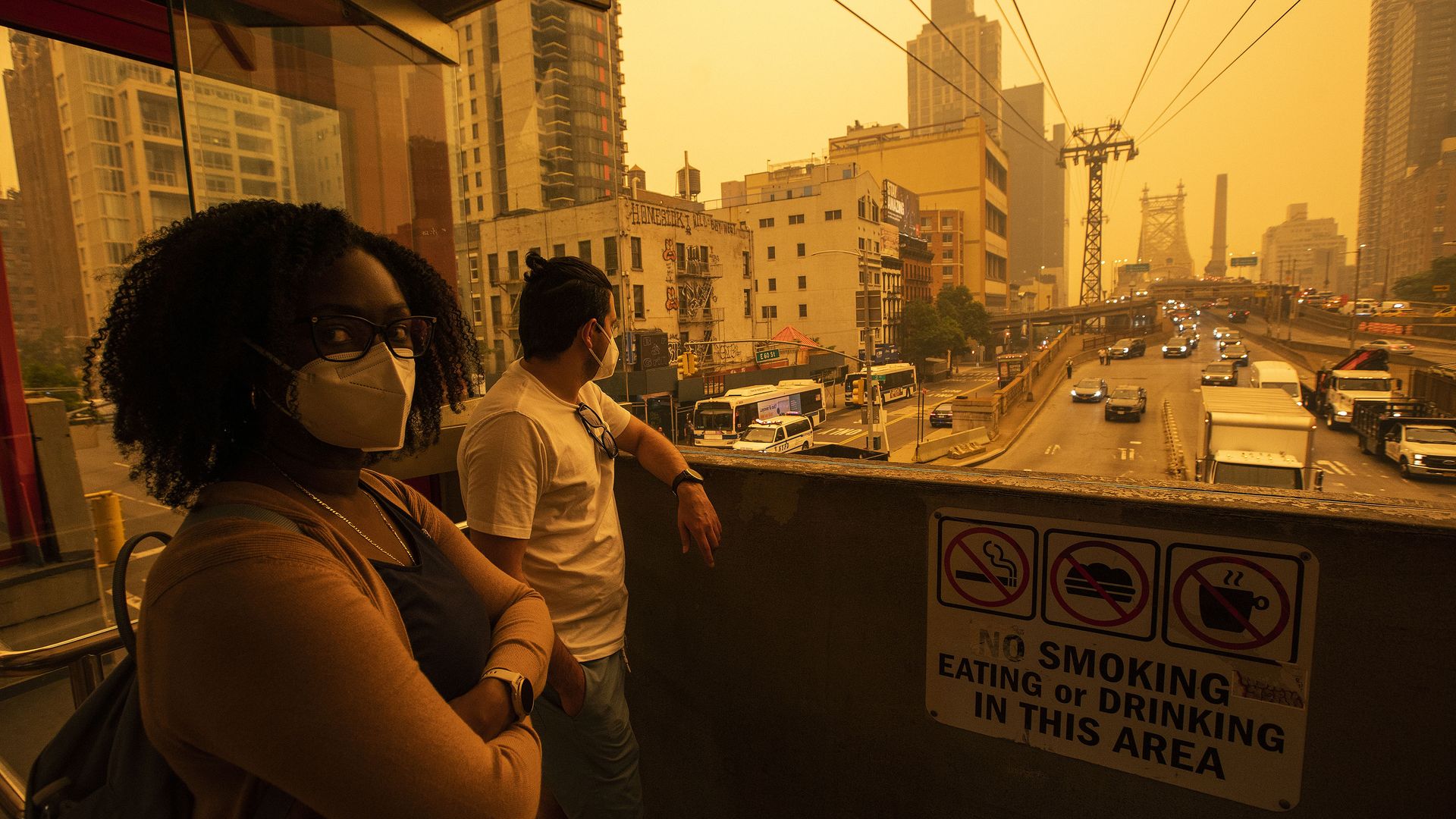 People wearing masks while waiting the tramway to Roosevelt Island in New York City on June 7.  