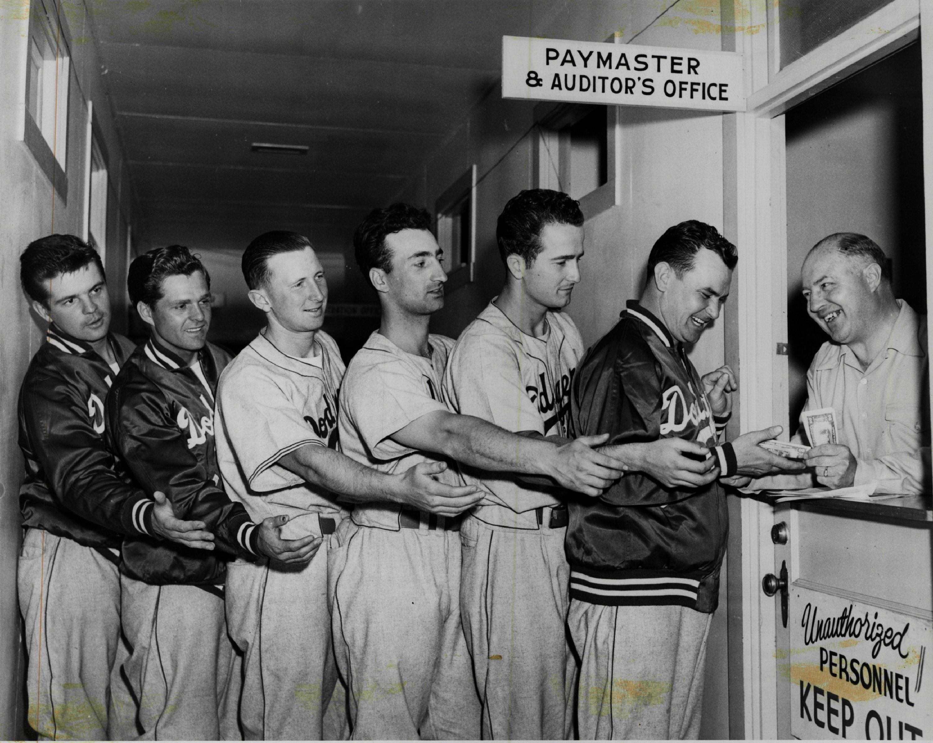 Dodgers players waiting on line for paychecks
