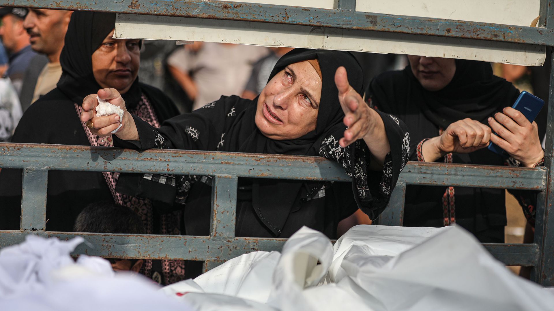 People mourn at the morgue of Nasser Hospital in Khan Yunis, Gaza. Photo: Mustafa Hassona/Anadolu via Getty Images