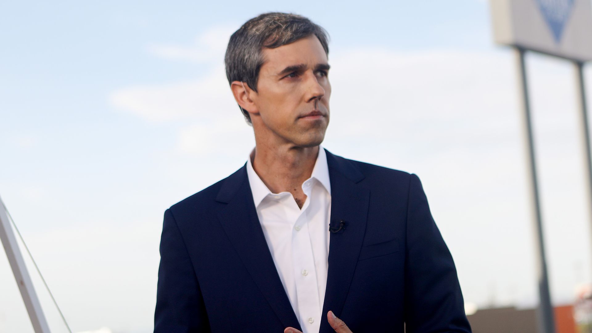 Beto standing and looking to the side. 