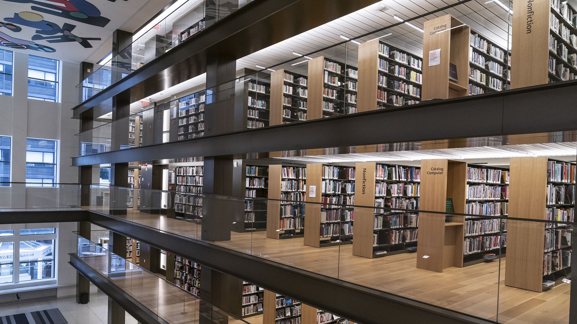 Photo of multiple floors of bookshelves at a library