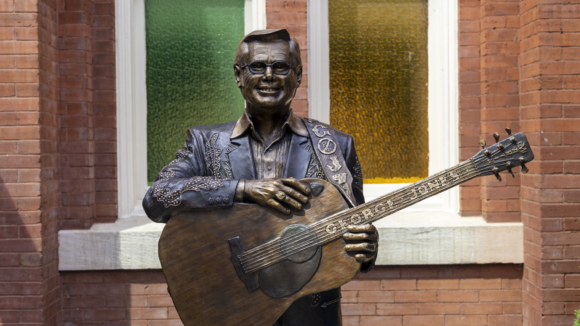 A statue of George Jones holding a guitar.
