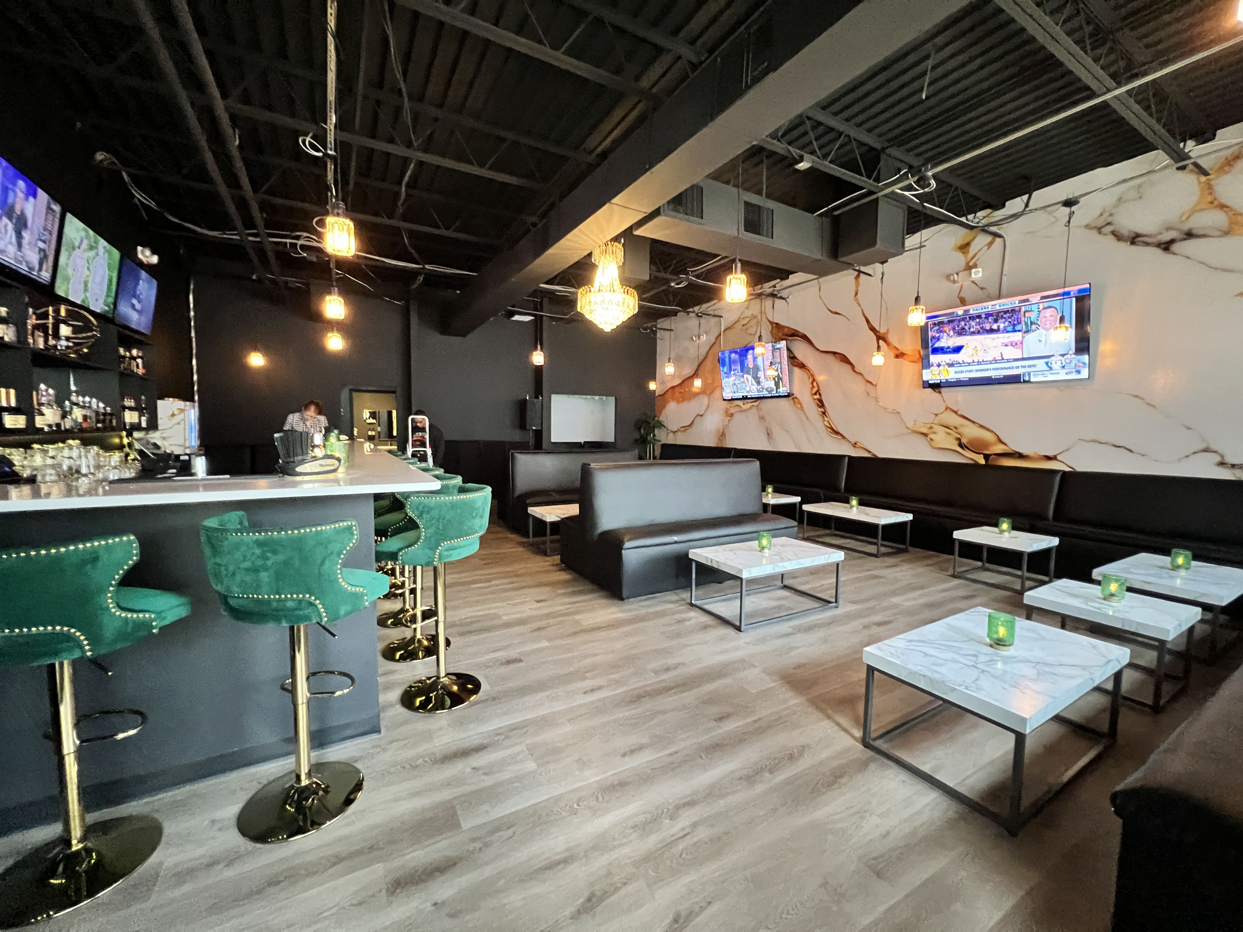 inside cocktial bar with booth seating