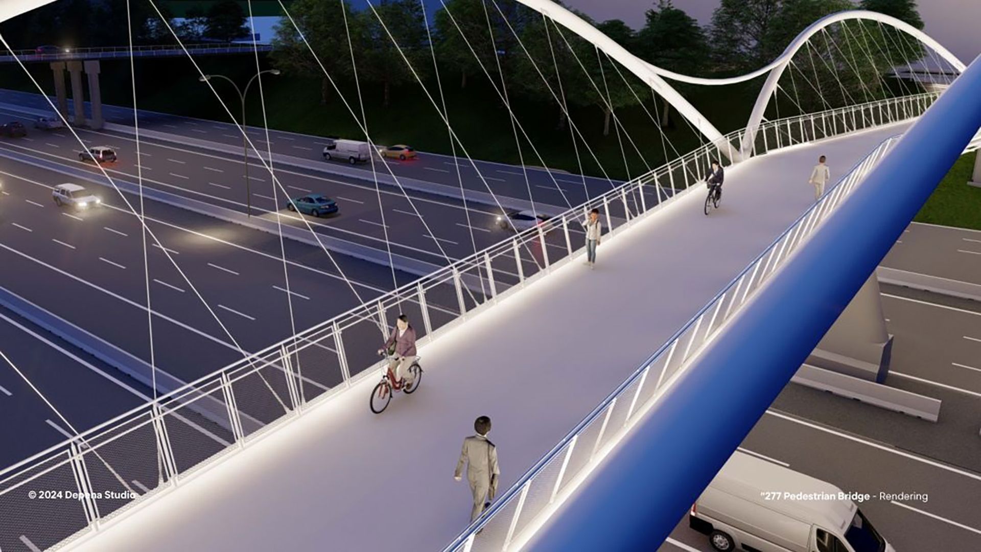 Night view of a modern, illuminated white pedestrian and bike bridge with people walking and cycling over a busy highway with multiple cars.