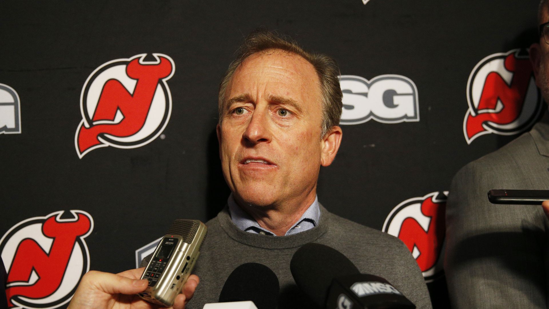 Josh Harris in front of microphones