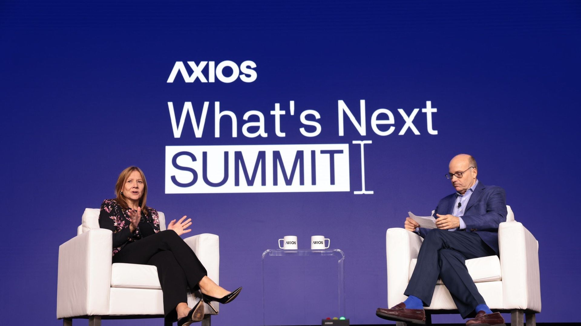 Photo of GM CEO Mary Barra talking to Axios' Mike Allen onstage at the Axios What's Next summit