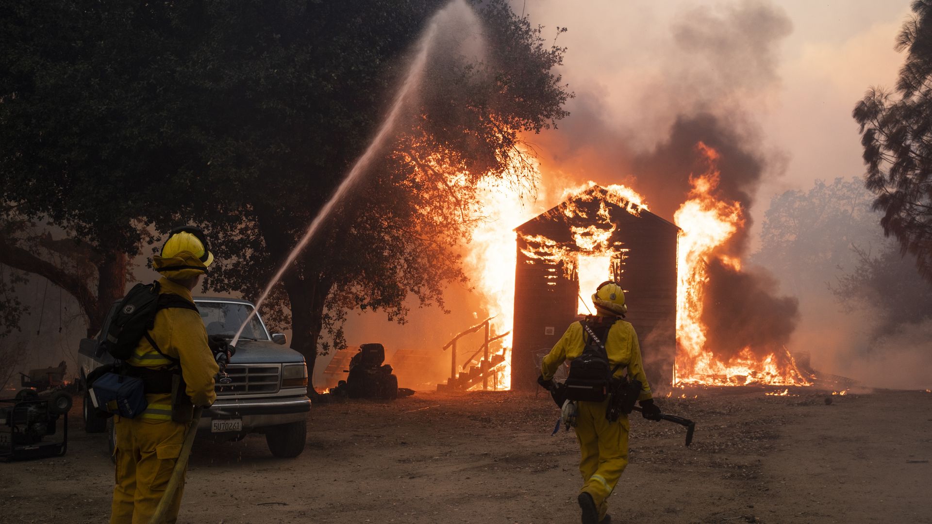 Firefighters work to prevent the fire from spreading during the Zogg fire near the town of Igo in Shasta County, California, U.S., on Sunday, Sept. 27, 2020. 