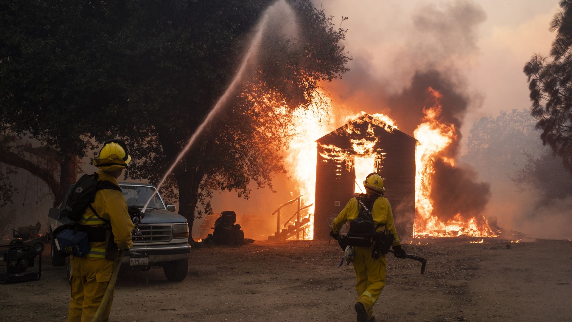 Firefighters work to prevent the fire from spreading during the Zogg fire near the town of Igo in Shasta County, California, U.S., on Sunday, Sept. 27, 2020.