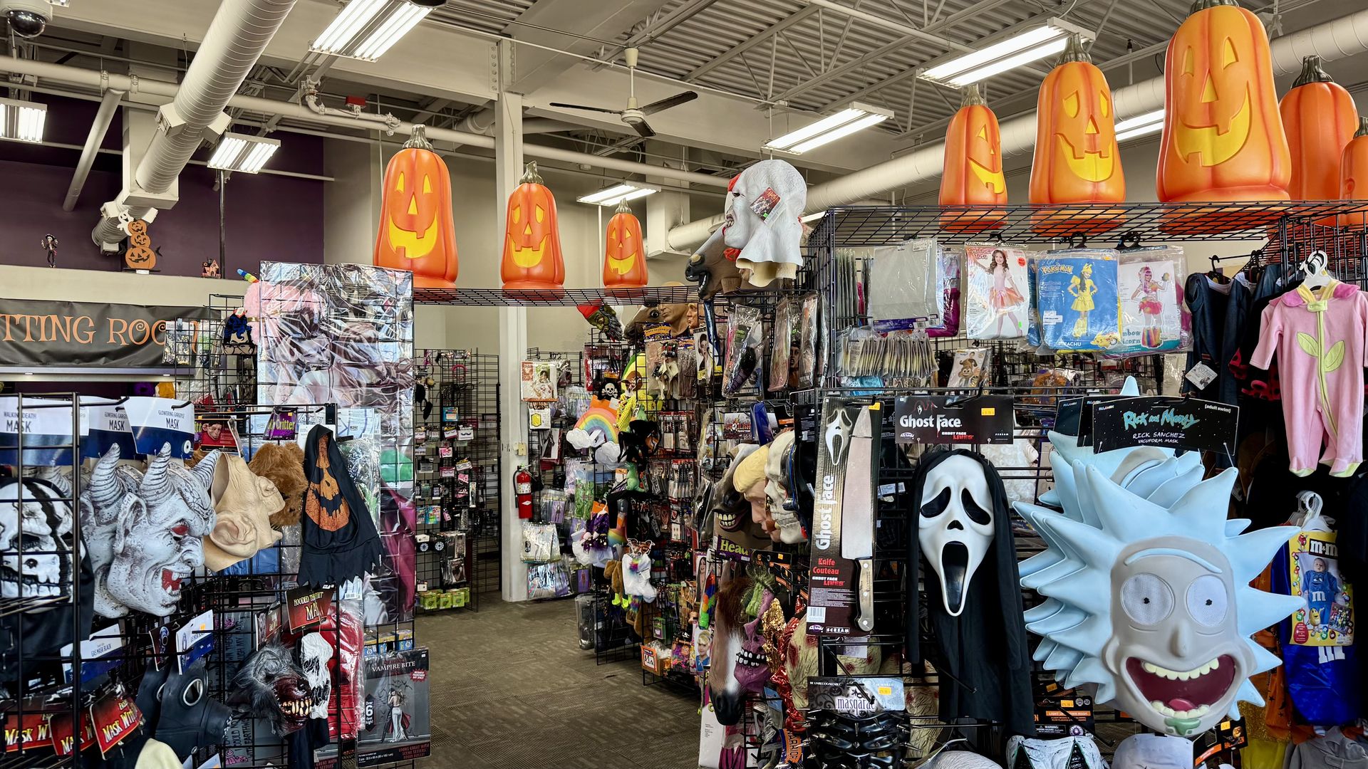 A ton of halloween retail offerings, including masks and pumpkin decorations