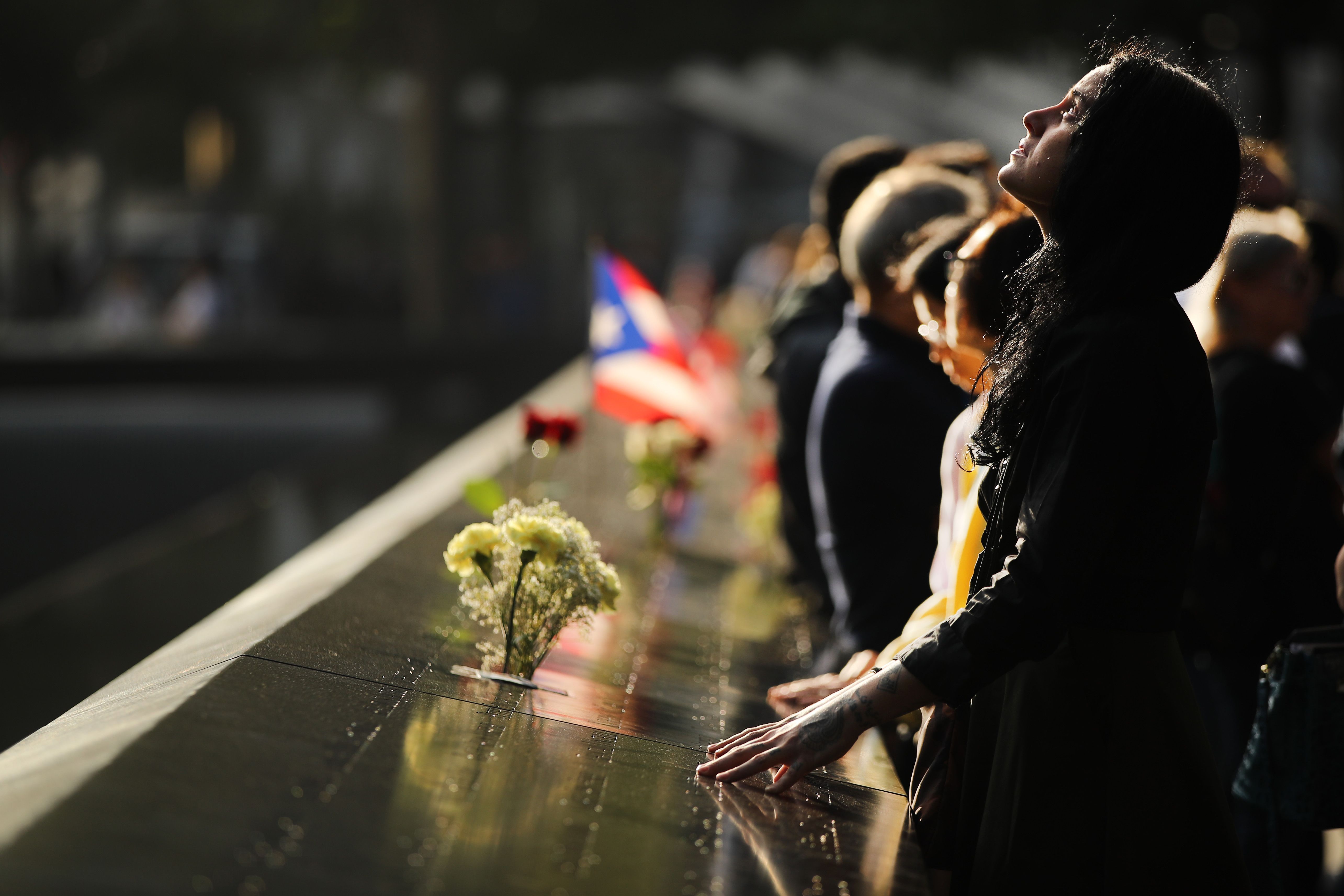 Alexandra Hamatie, whose cousin Robert Horohoe was killed on September 11, pauses at the National September 11 Memorial 