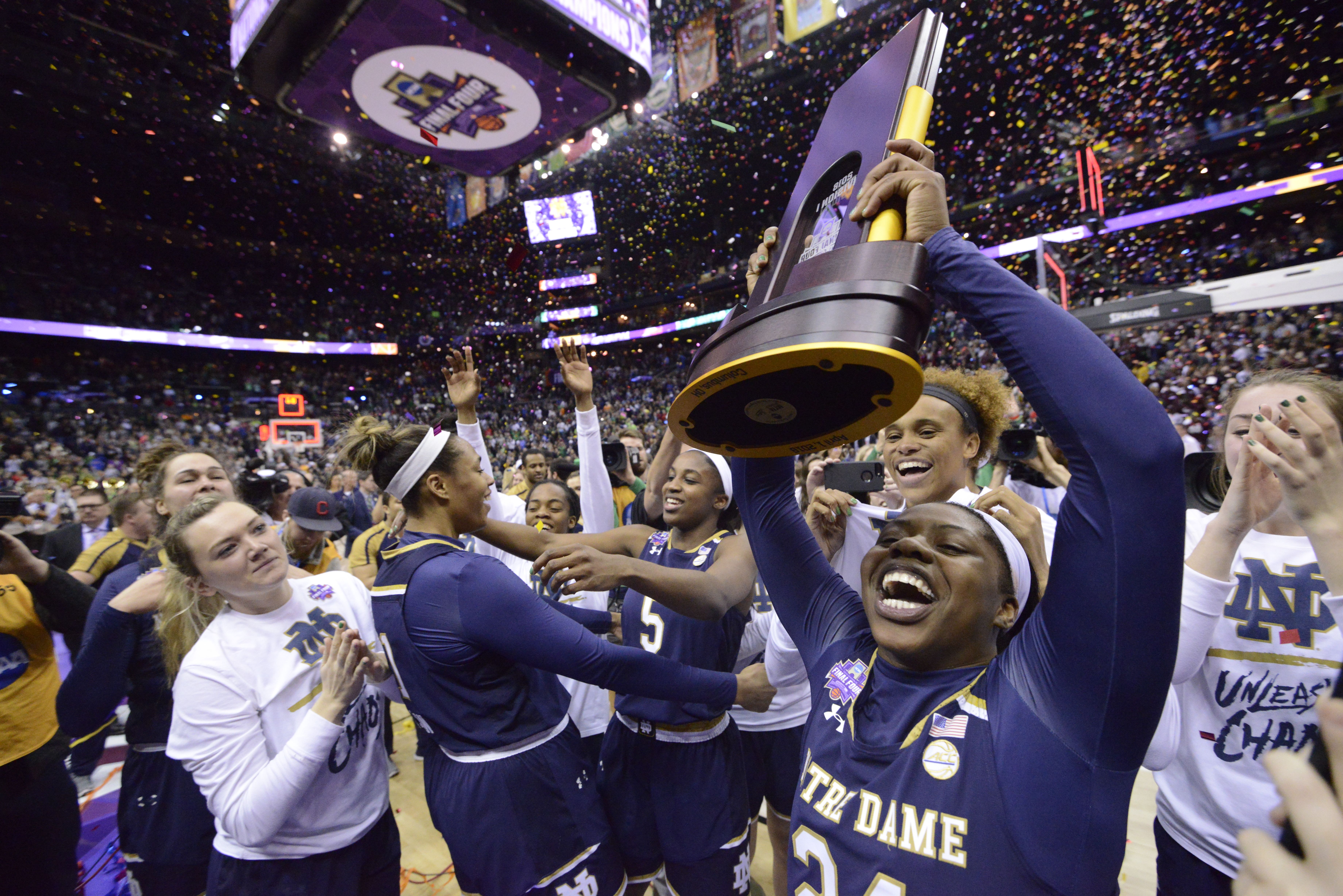 Photo of women celebrating after winning a basketball game. 