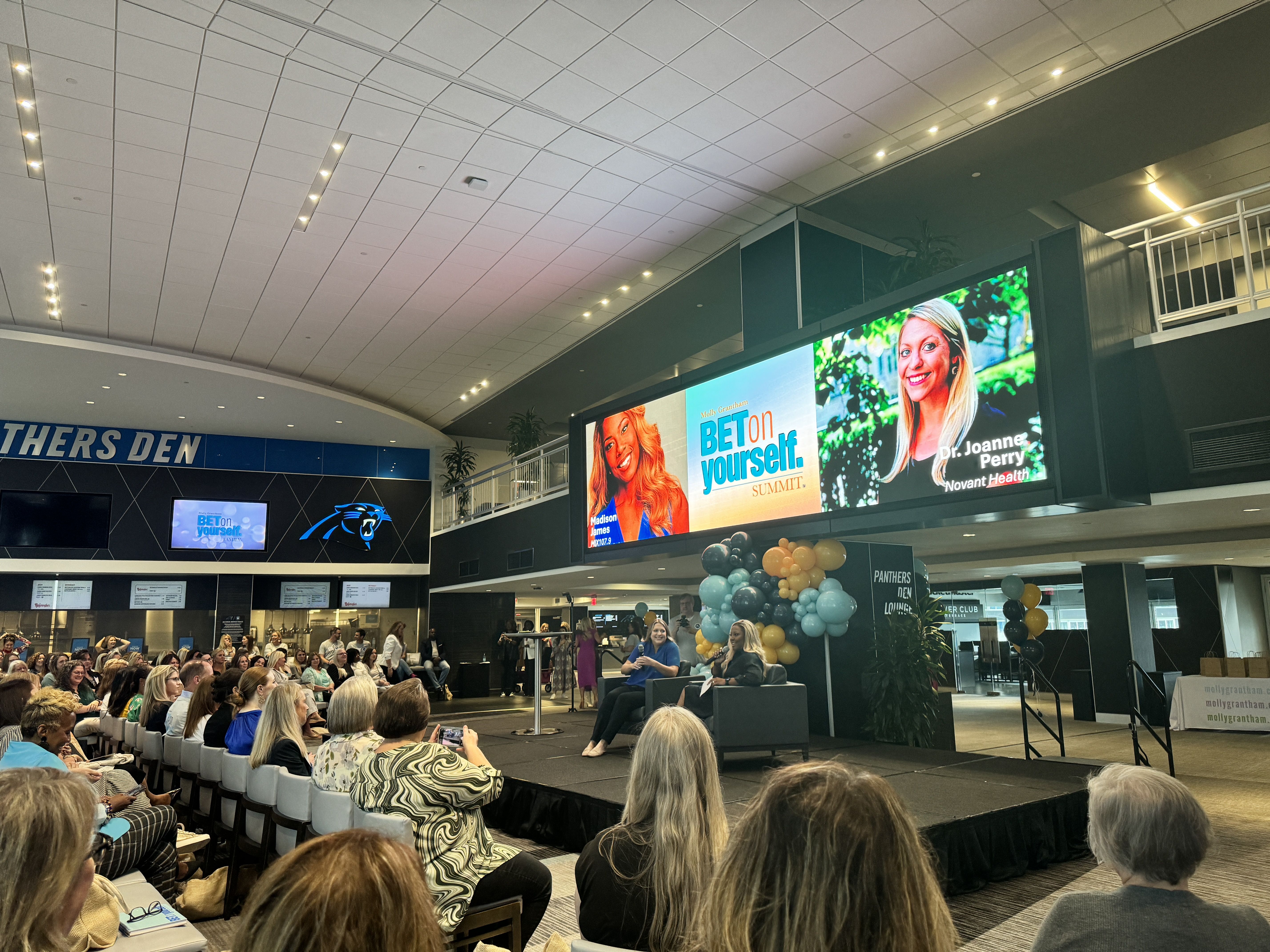 two people talking on stage