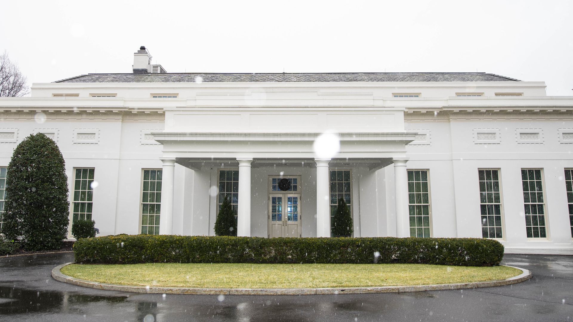 The West Wing is seen under light snow on Super Sunday.
