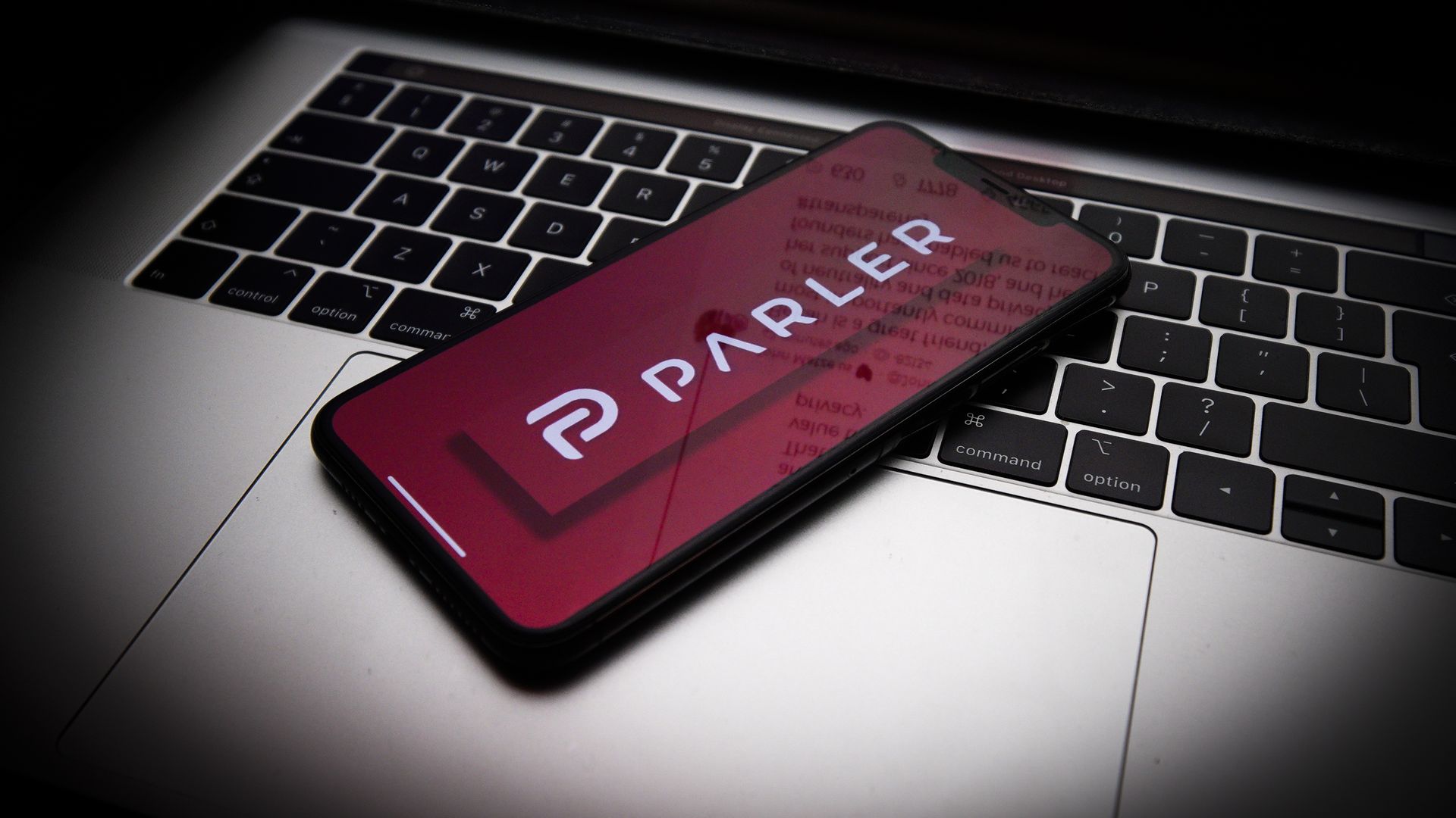 The Parler logo is seen on an Apple iPhone. Photo: Getty Images