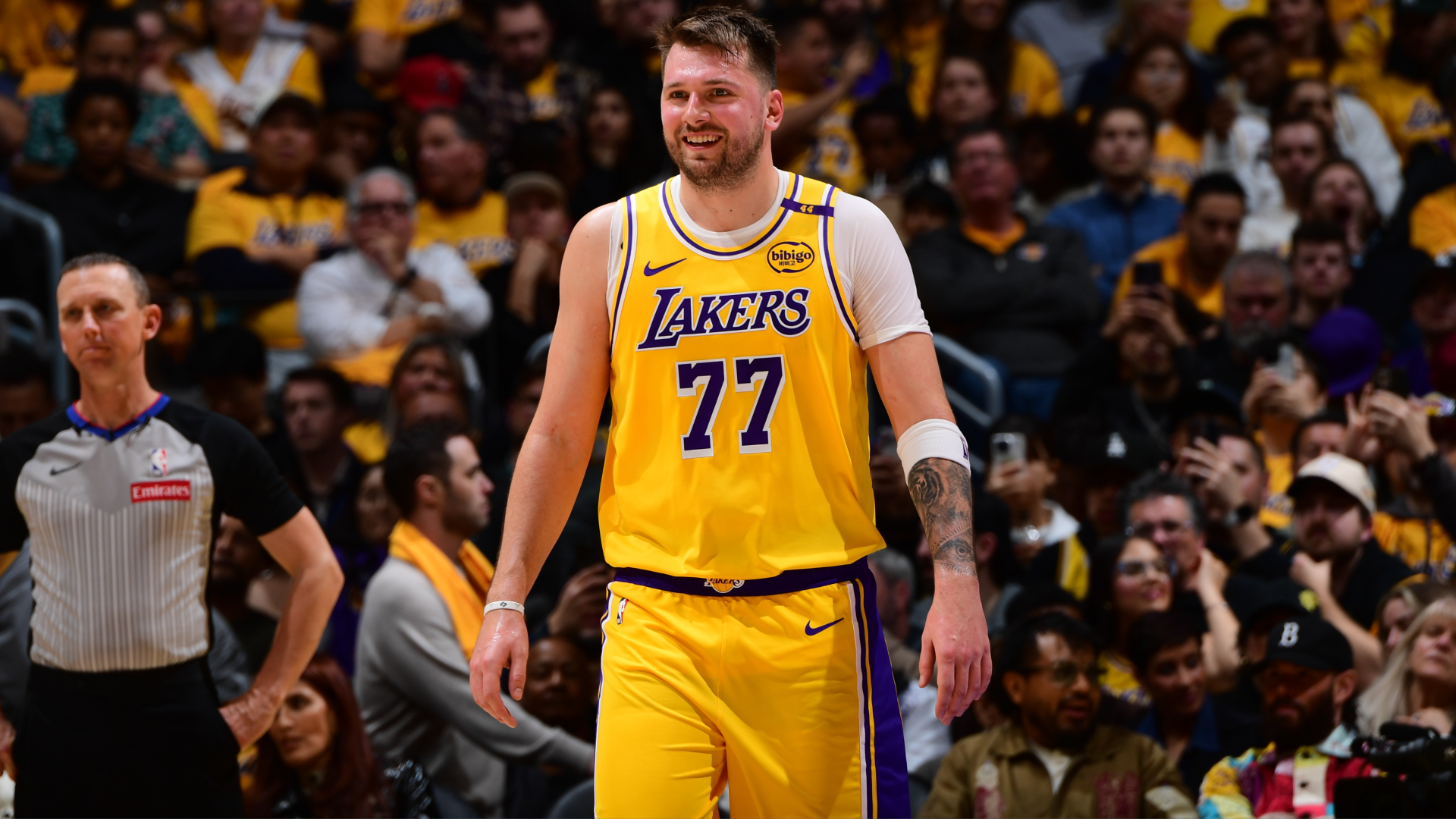 Luka Doncic wears a Lakers uniform with the number 77