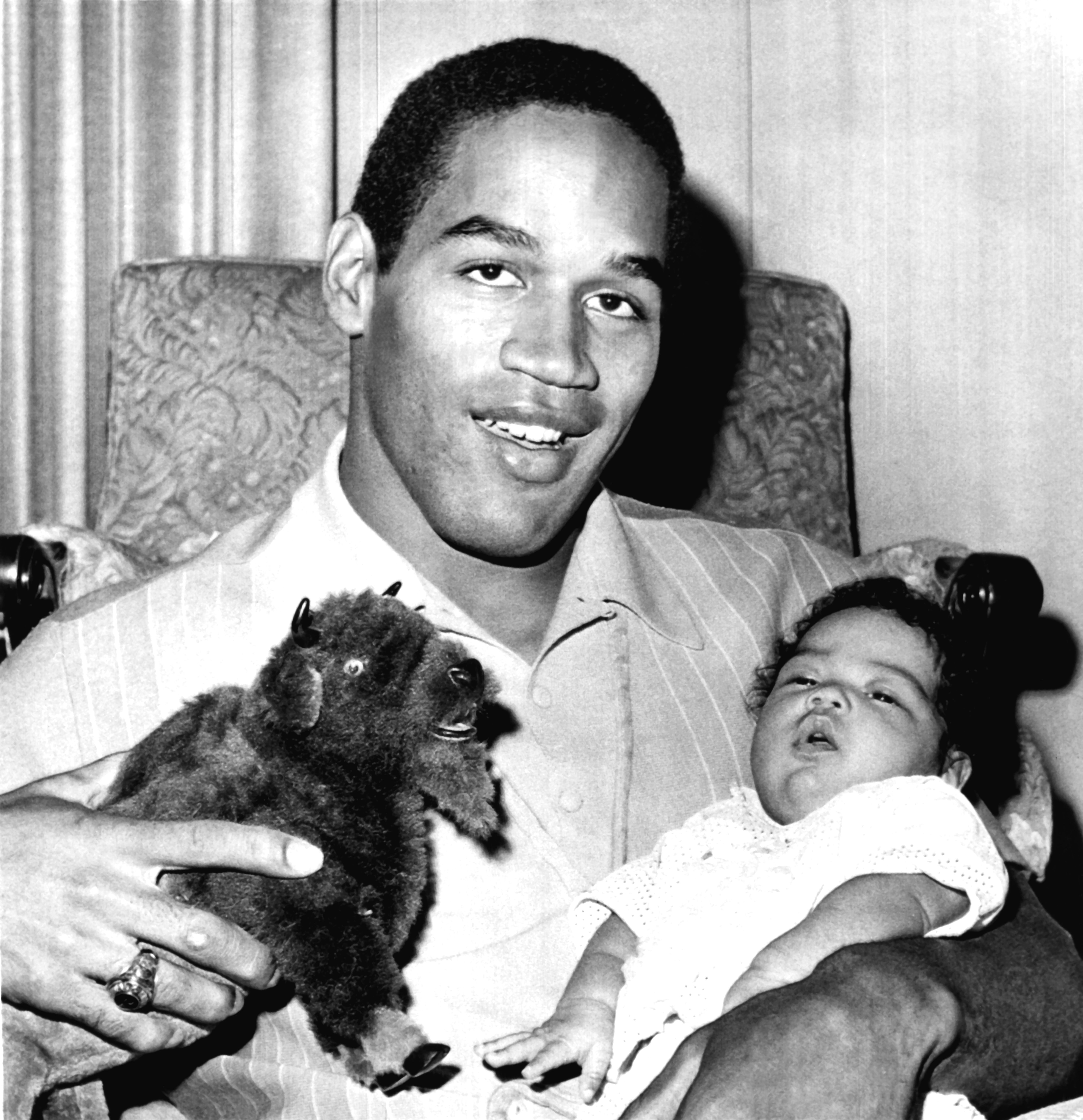 O.J. Simpson holding his daughter