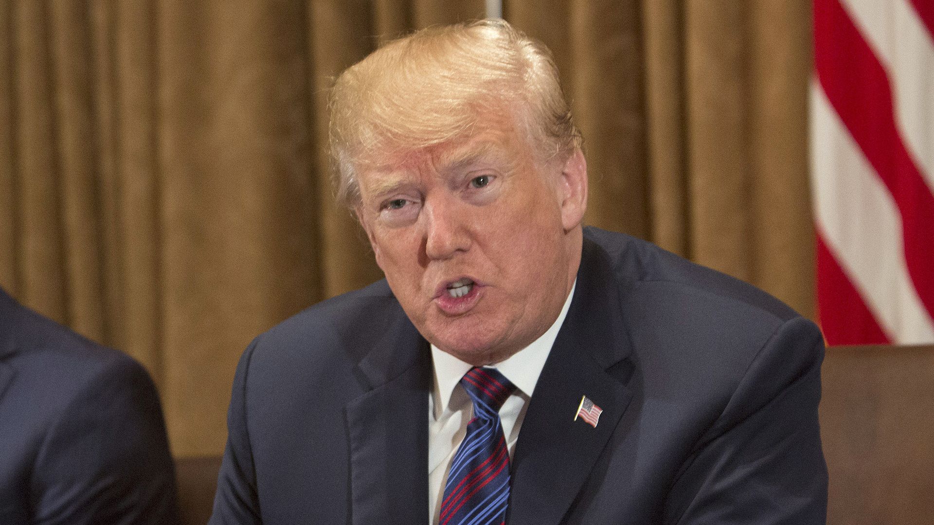 President Trump gestures while speaking