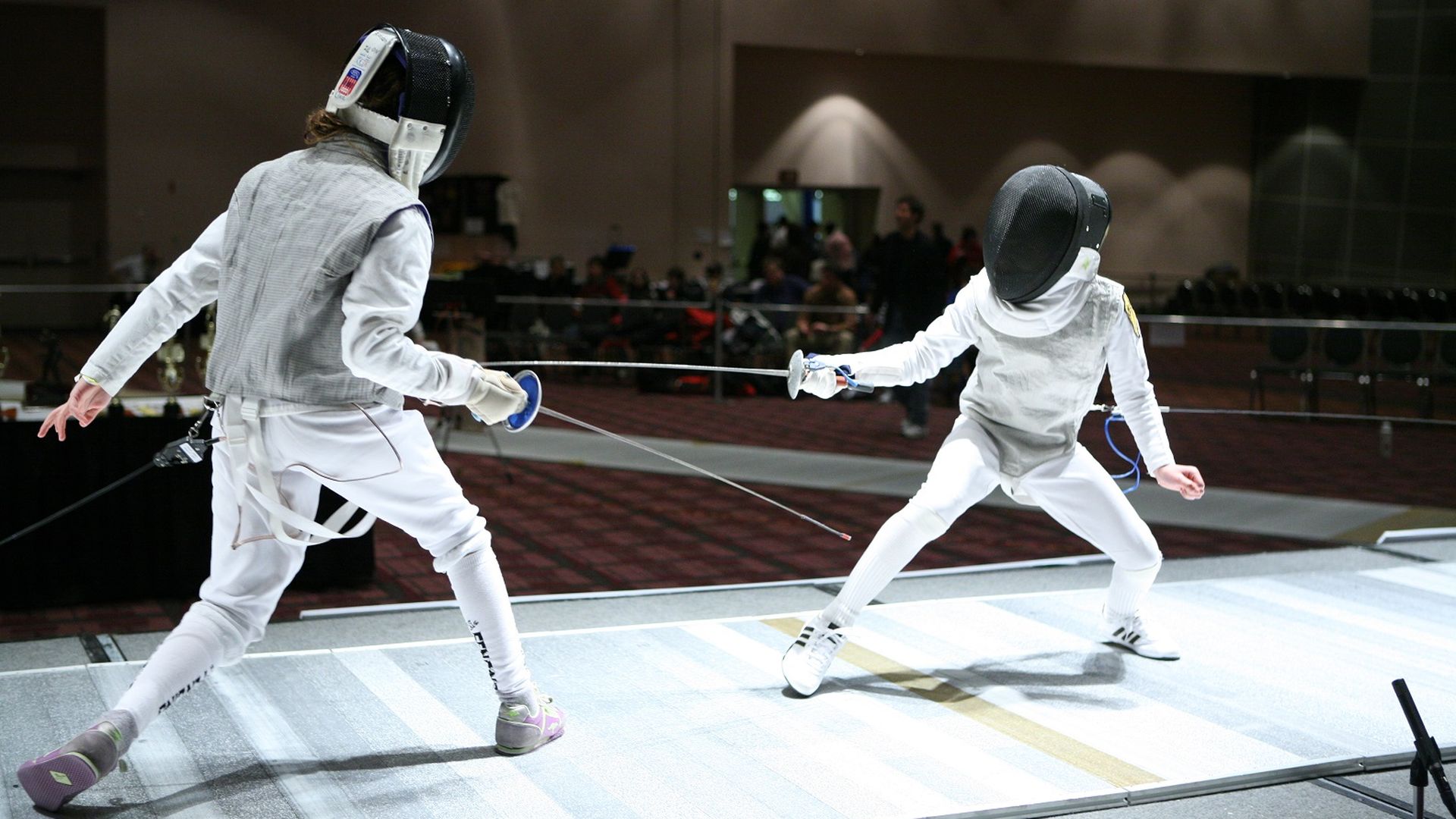Two fencers competing