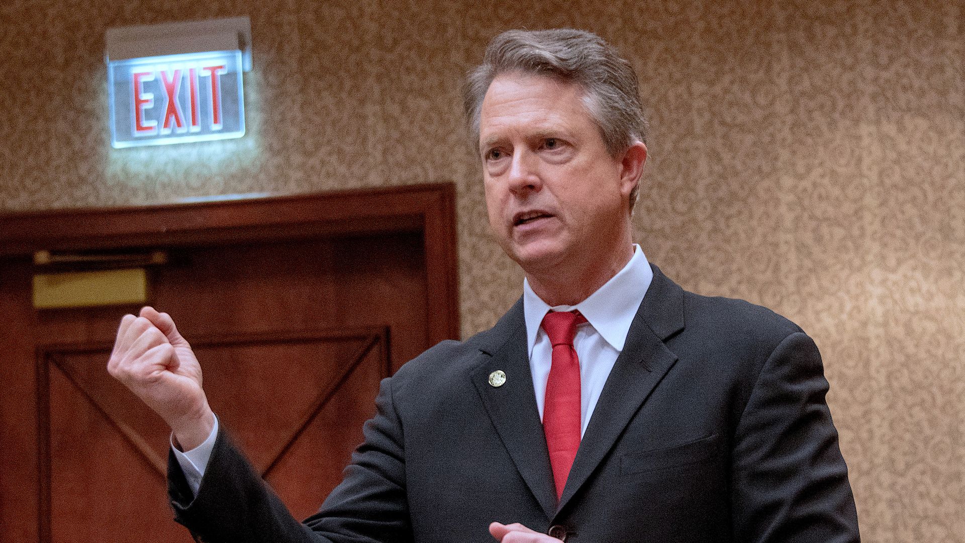 Rep. Roger Marshall with his hand in a fist as he speaks