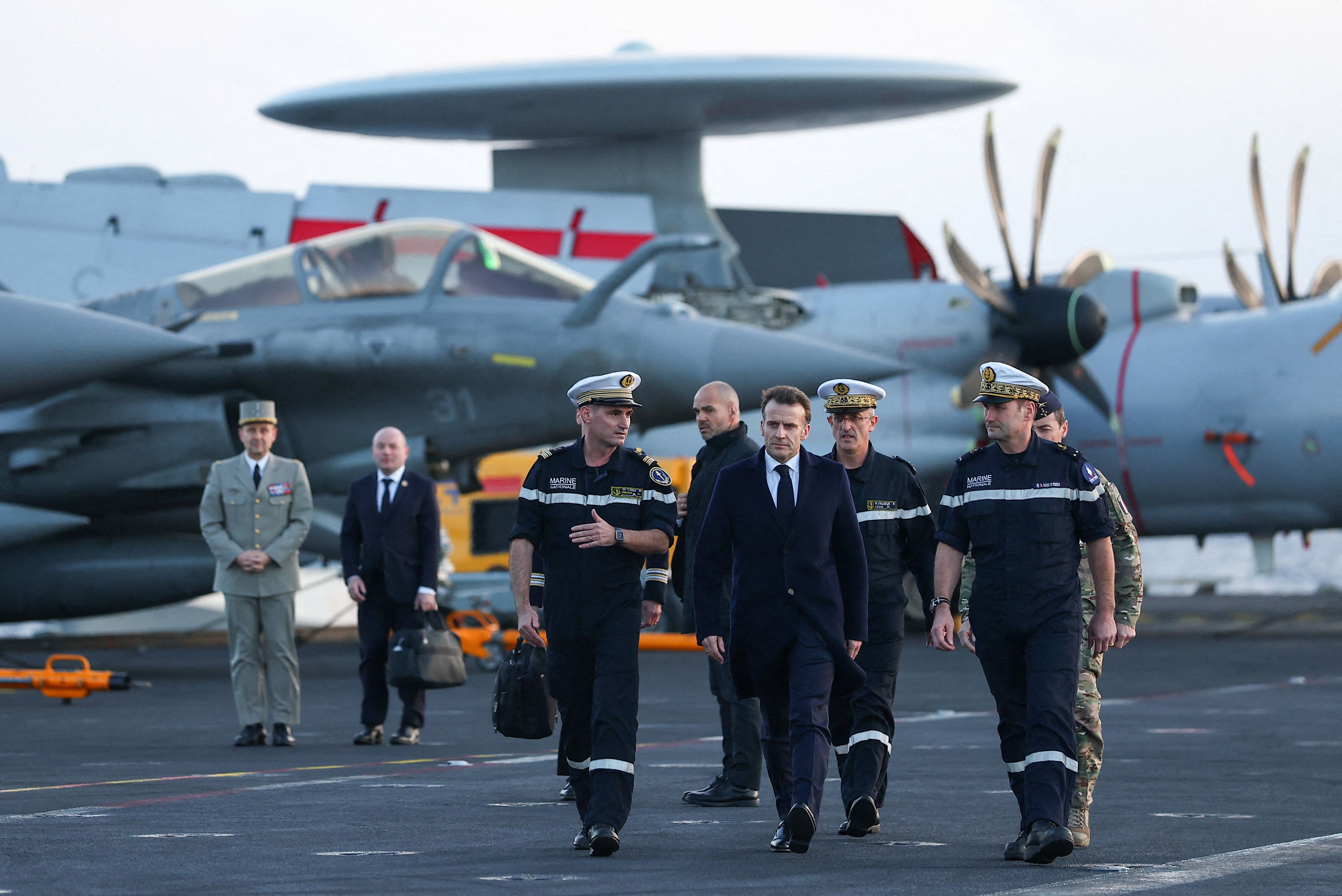 French President Emmanuel Macron visits the Charles de Gaulle — an aircraft carrier — in the Mediterranean Sea yesterday.