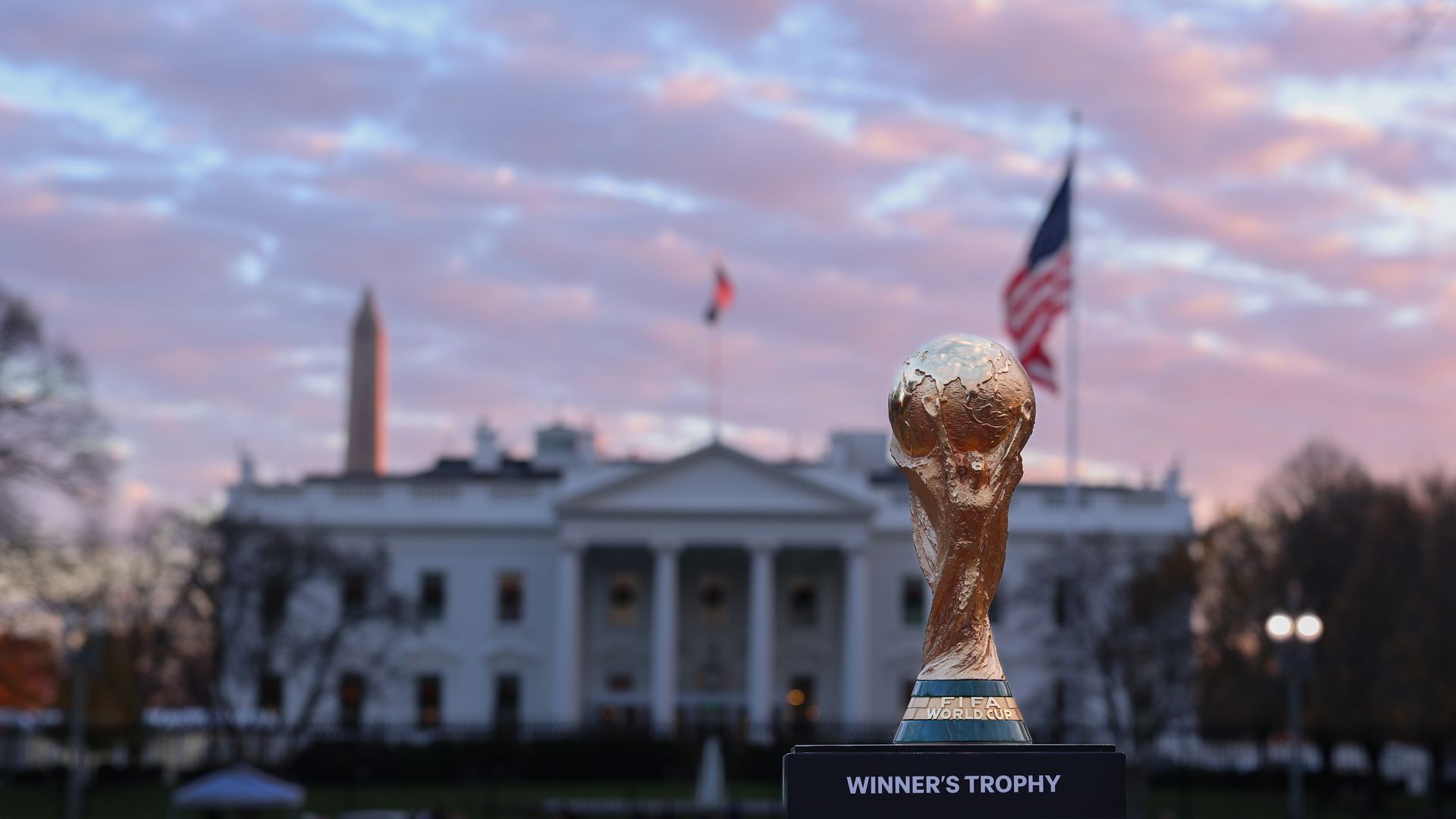 The FIFA World Cup Trophy stands outside the White House.