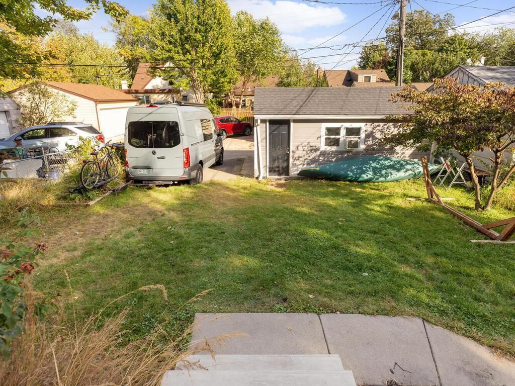 A backyard with a detached garage visible.