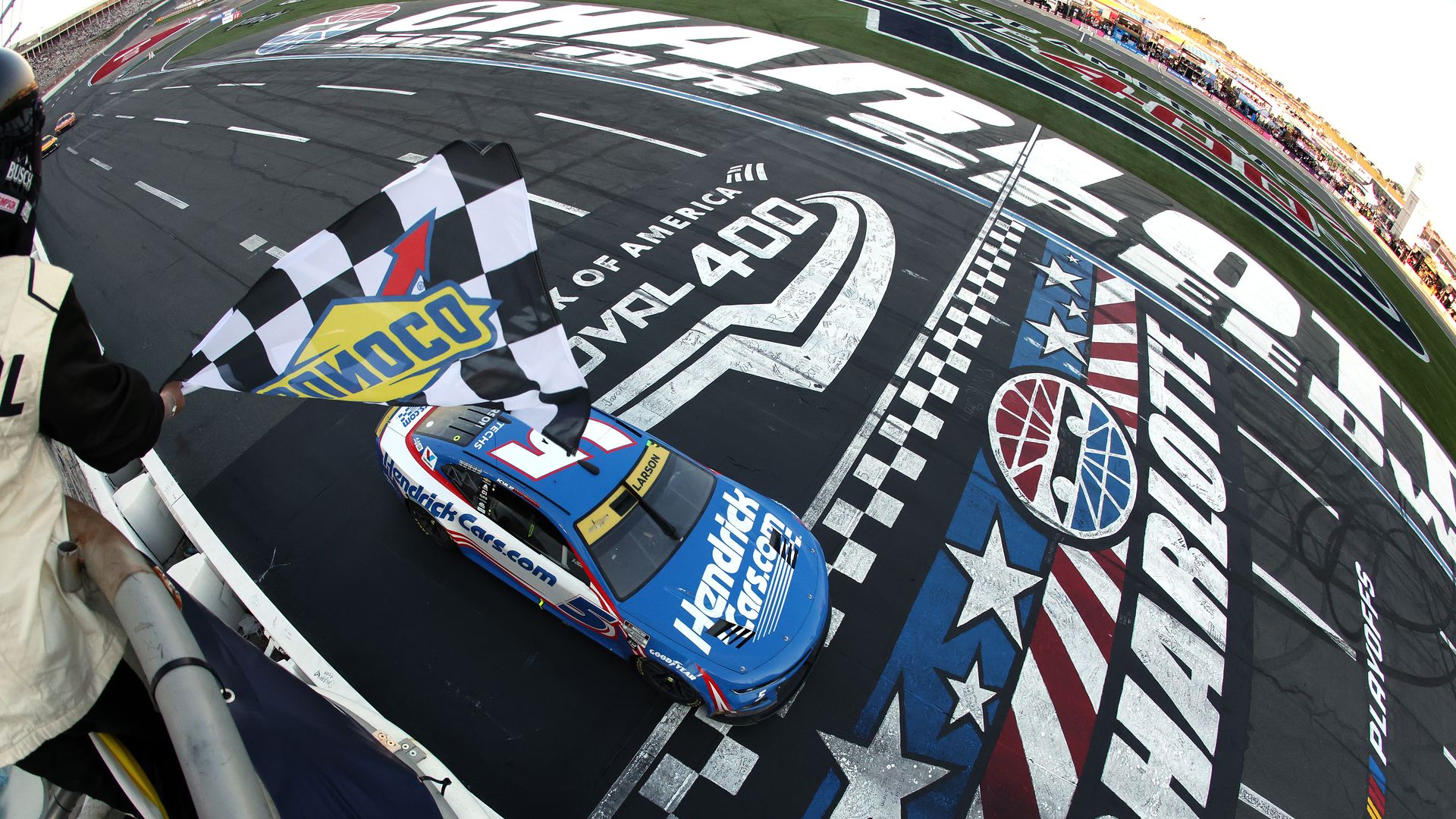  Kyle Larson, driver of the #5 HendrickCars.com Chevrolet, takes the checkered flag to win the NASCAR Cup Series Bank of America ROVAL 400 at Charlotte Motor Speedway on October 13, 2024 in Concord, North Carolina. (Photo by Meg Oliphant/Getty Images)