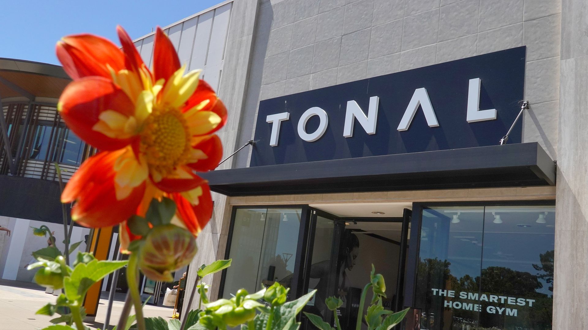 A sign is posted in front of a Tonal store at Stanford Shopping Center
