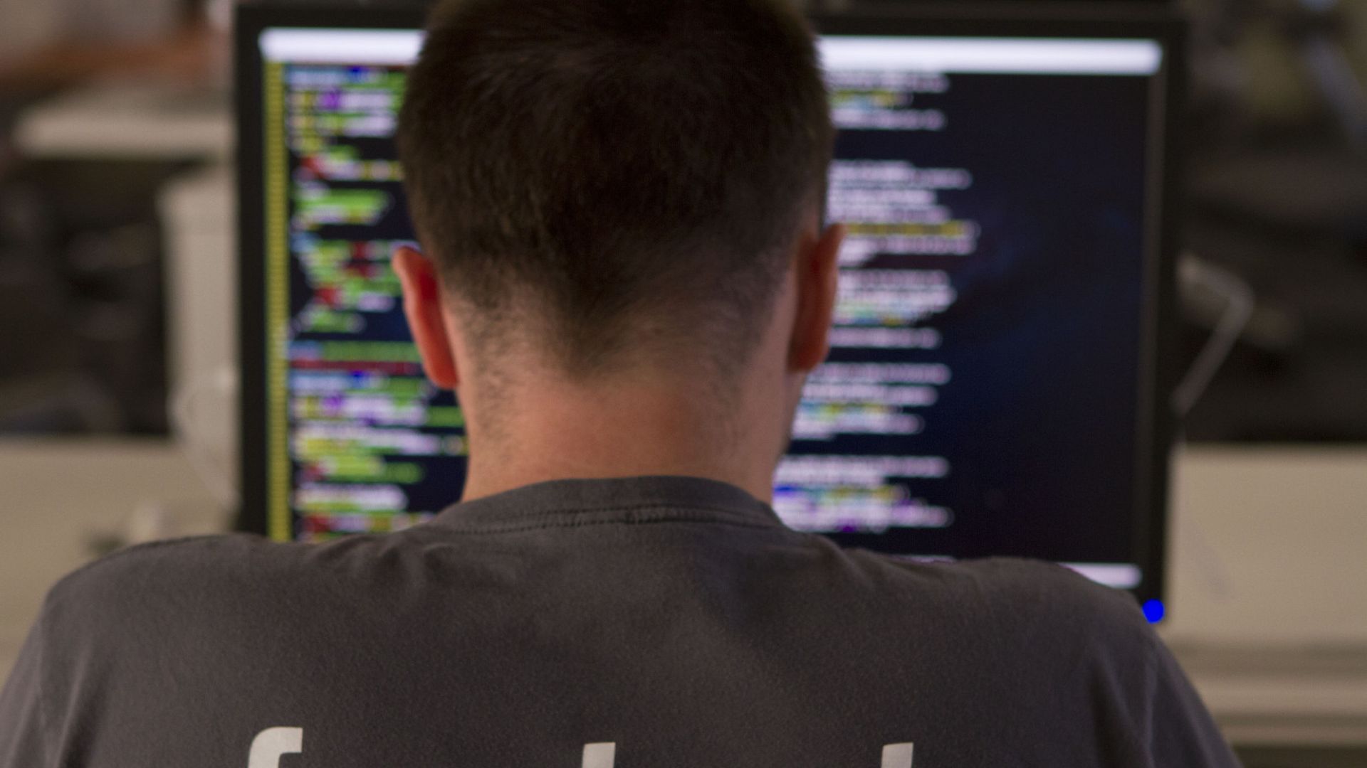 A newly hired Facebook worker at their desk