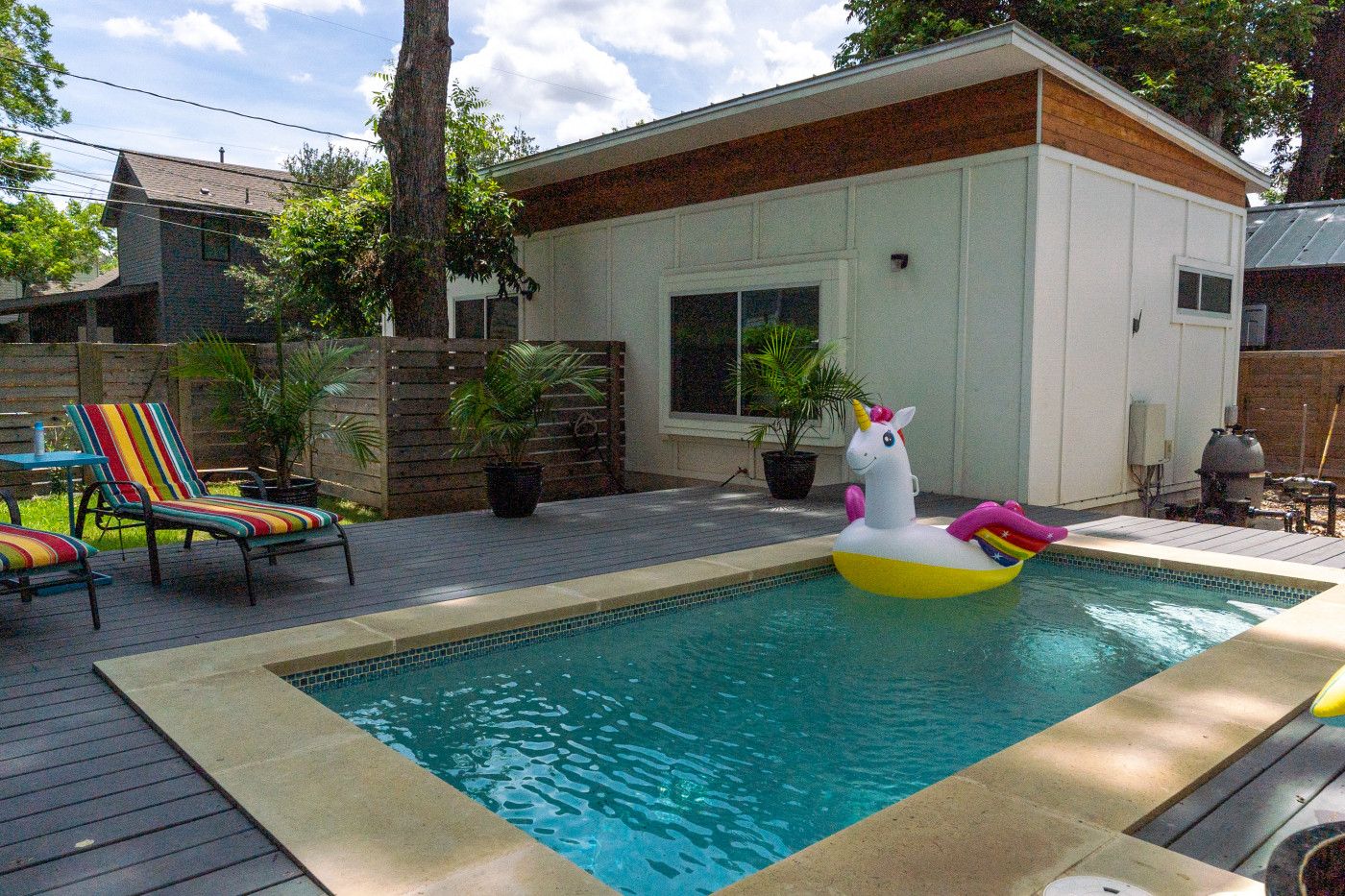 small plunge pool with a unicorn float