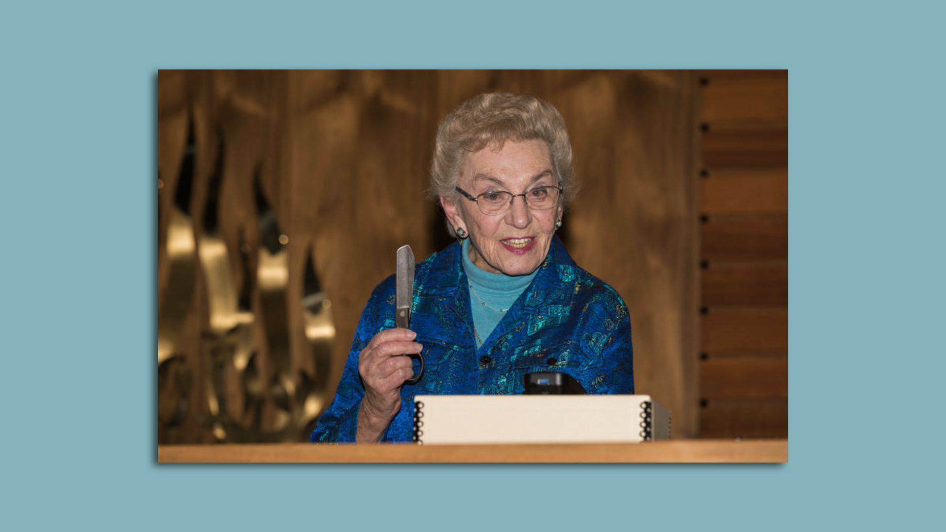 Celina Karp Biniaz holds a pair of scissors Oskar Schindler gave her family to barter for supplies after being liberated from his factory in 1945.