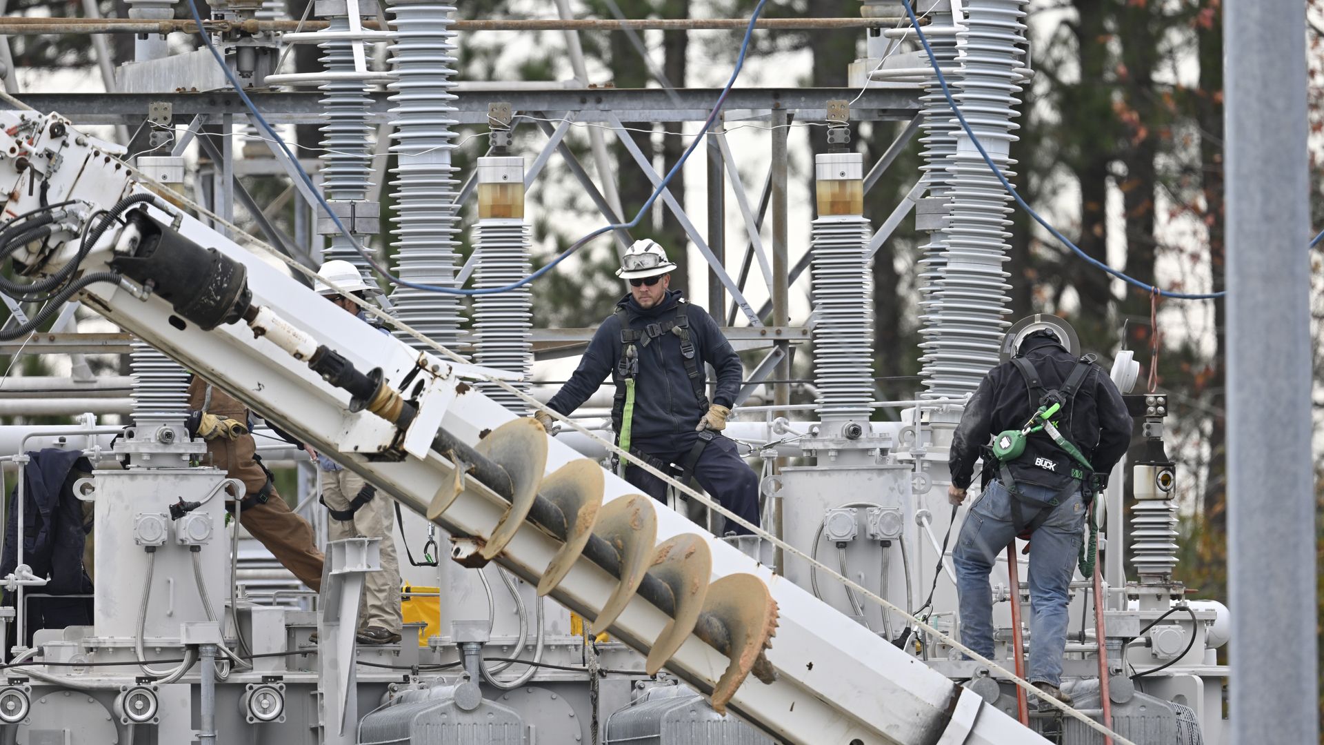Utility workers in December 2022 attempting to restore power to North Carolina's Moore County after two substations owned by Duke Electric were attacked.