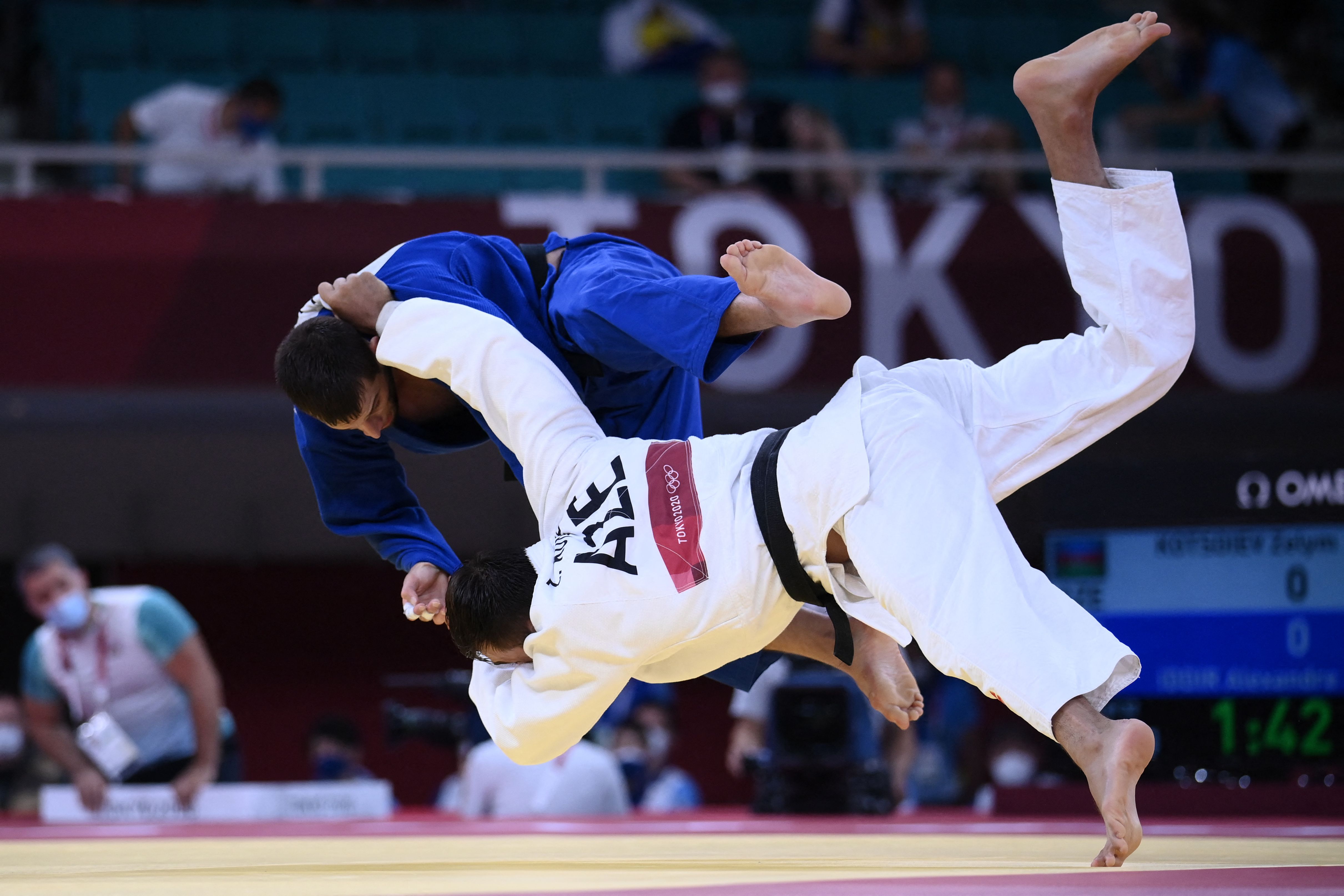 Azerbaijan's Zelym Kotsoiev (white) and France's Alexandre Iddir compete in the judo men's -100kg elimination round during the Tokyo 2020 Olympic Games on July 29