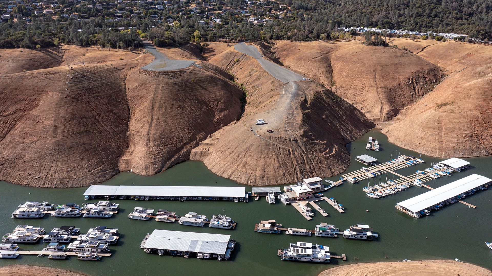 Houseboats on Lake Oroville during a drought in California that has dried out the lake bottom.
